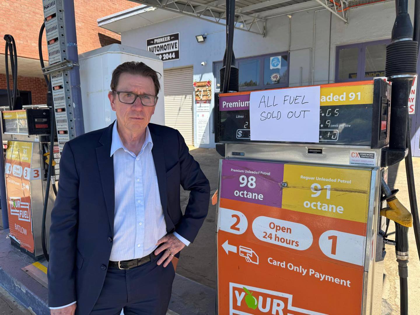 Member for Wagga Wagga Dr Joe McGirr stands by Batlow service station, which has run out of fuel.