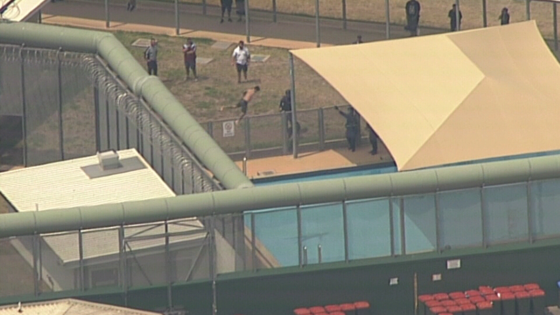 One of the inmates jumped from the roof into a swimming pool.