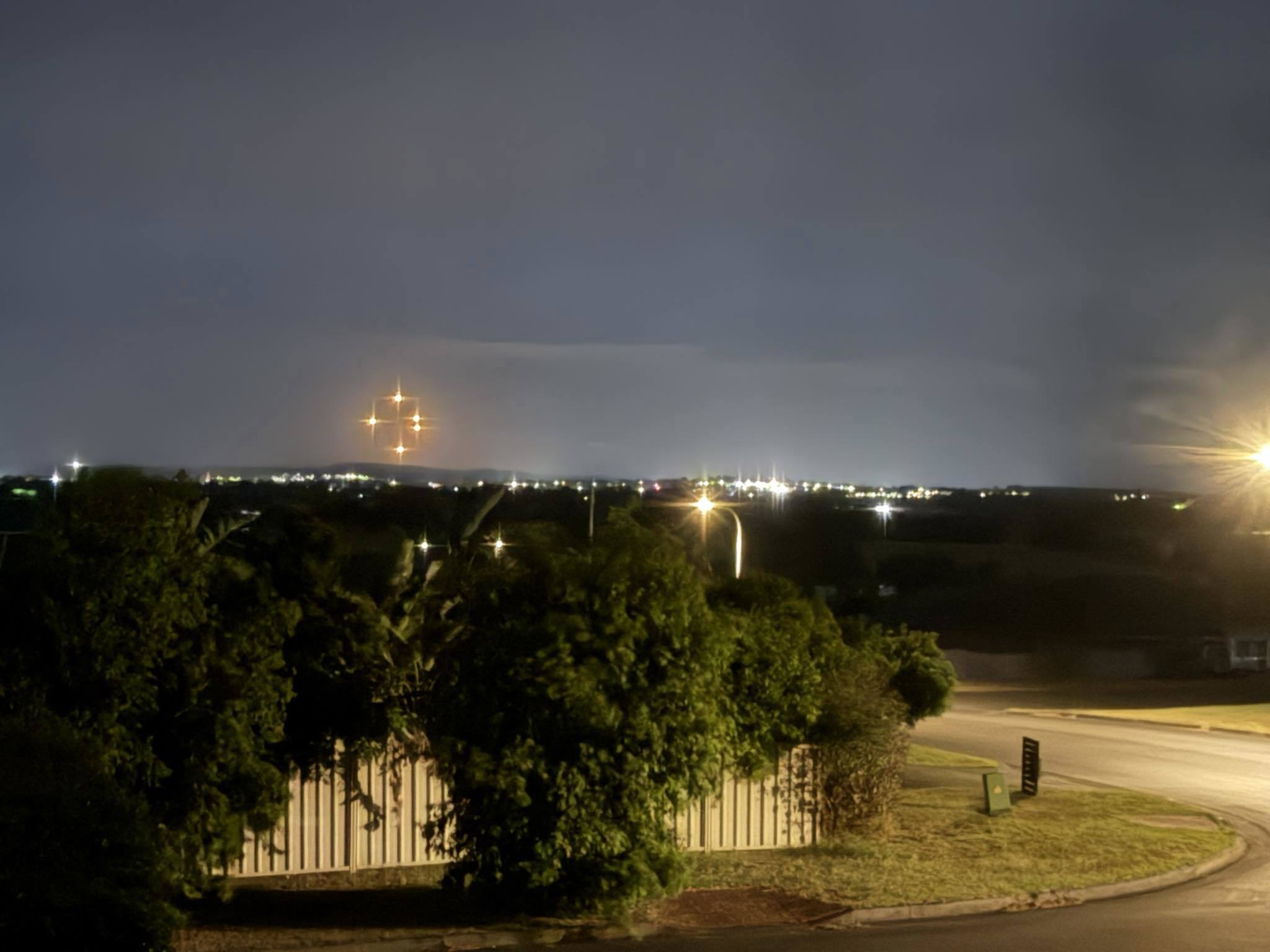 Wild theories have emerged as mysterious "glowing orange orbs" were seen in the sky across parts of the NSW Hunter region. 