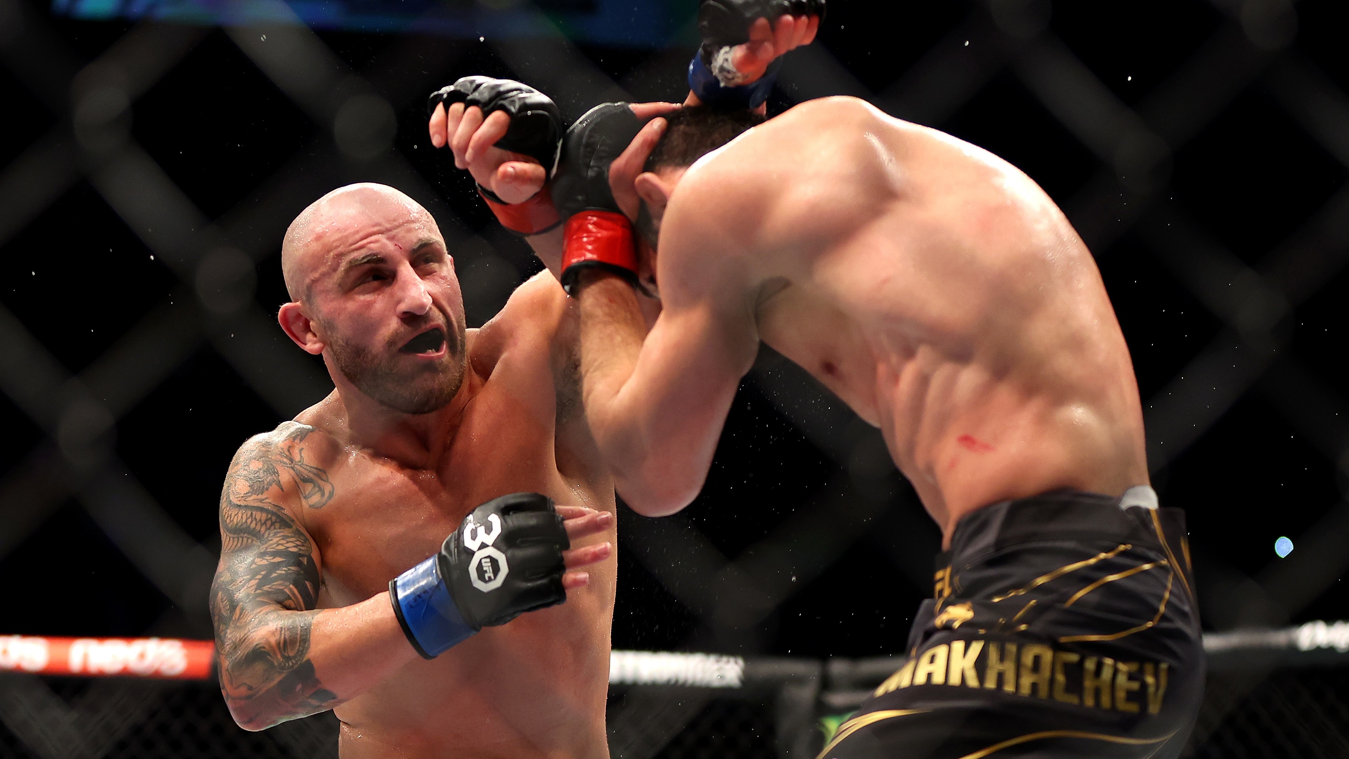 Alex Volkanovski lands a punch that levelled Islam Makhachev in their UFC lightweight championship fight during UFC 284 at RAC Arena.