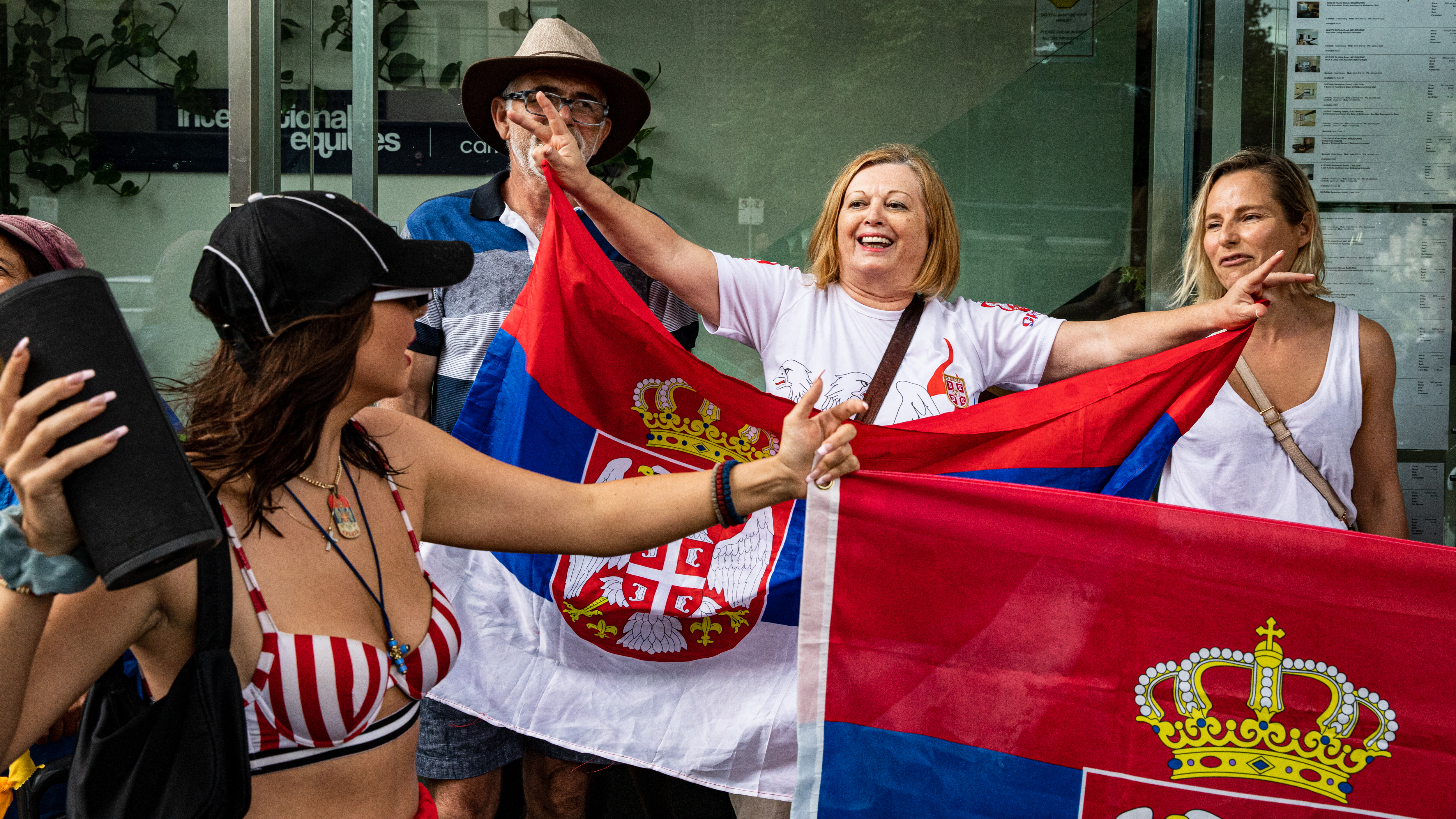 Supporters gather outside Park Hotel where Novak Djokovic was taken pending his removal from the country after his visa was cancelled by the Australian Border Force in Melbourne, Australia.  It's also which is also where refugees are held.
