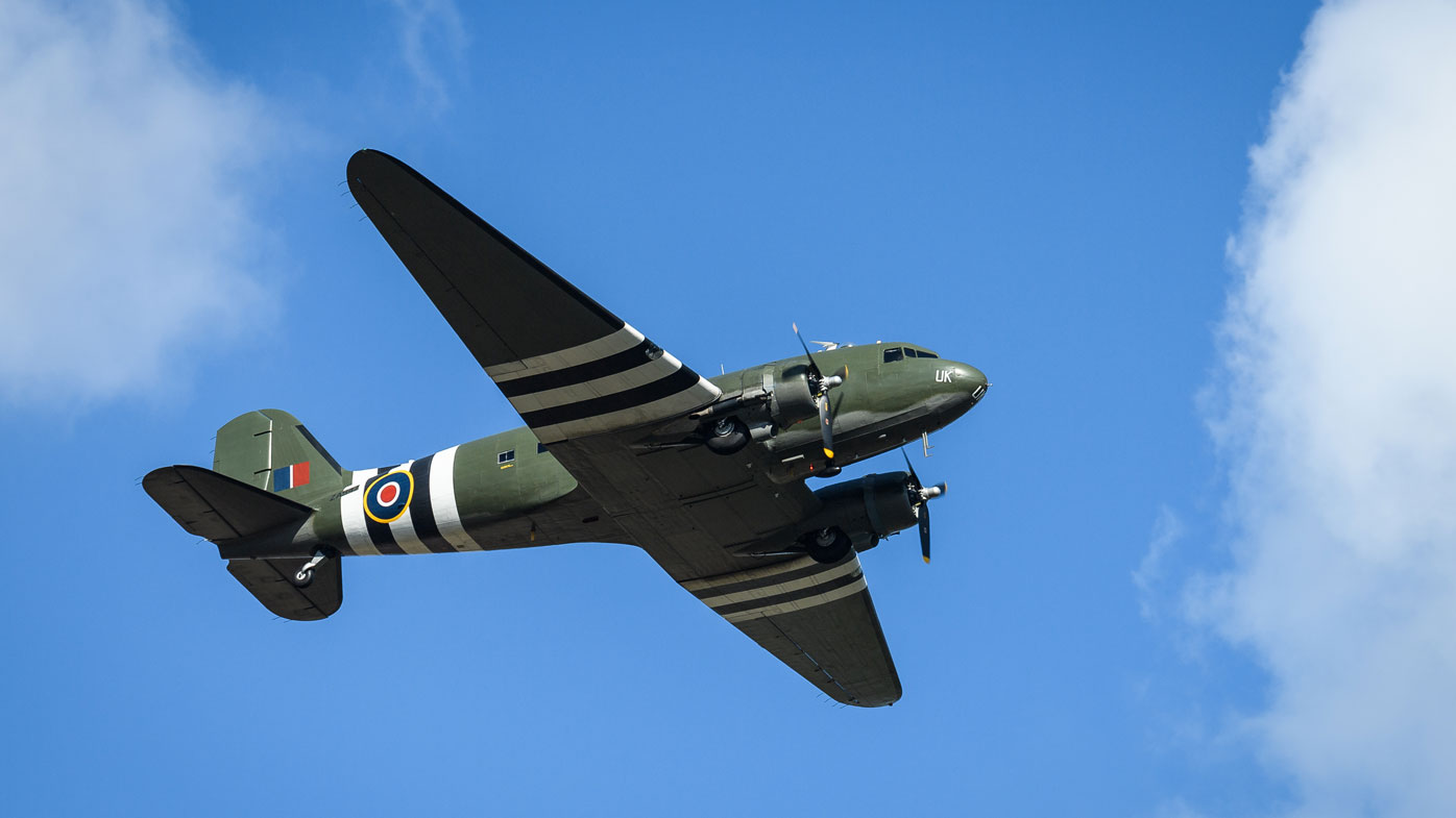 A vintage C-47 Dakota performs a flypast over Bedford crematorium as a funeral service for Sir Tom Moore takes place on February 27, 2021 in Bedford, England