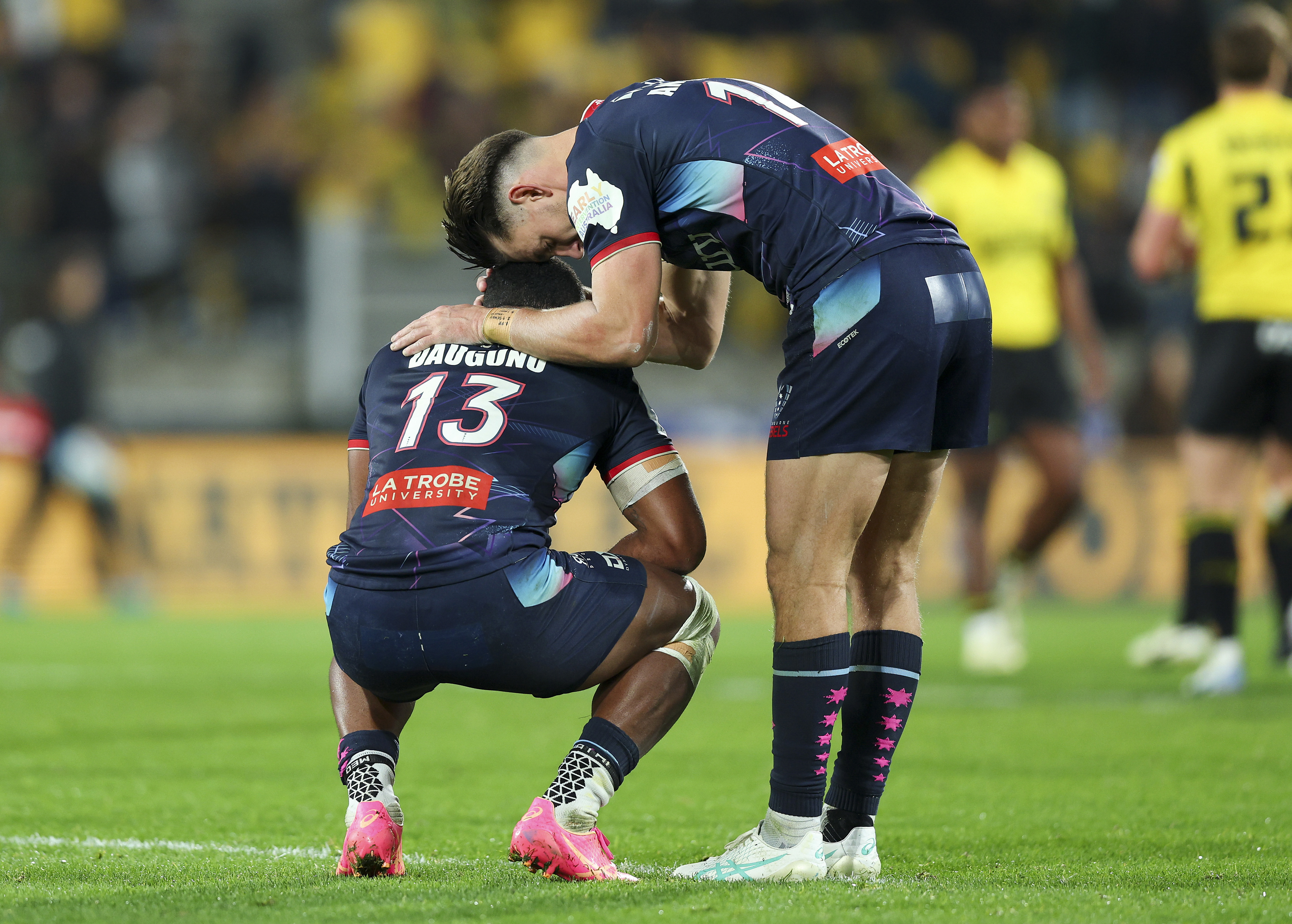 Filipo Daugunu and Lachie Anderson of the Rebels react after the final whistle.