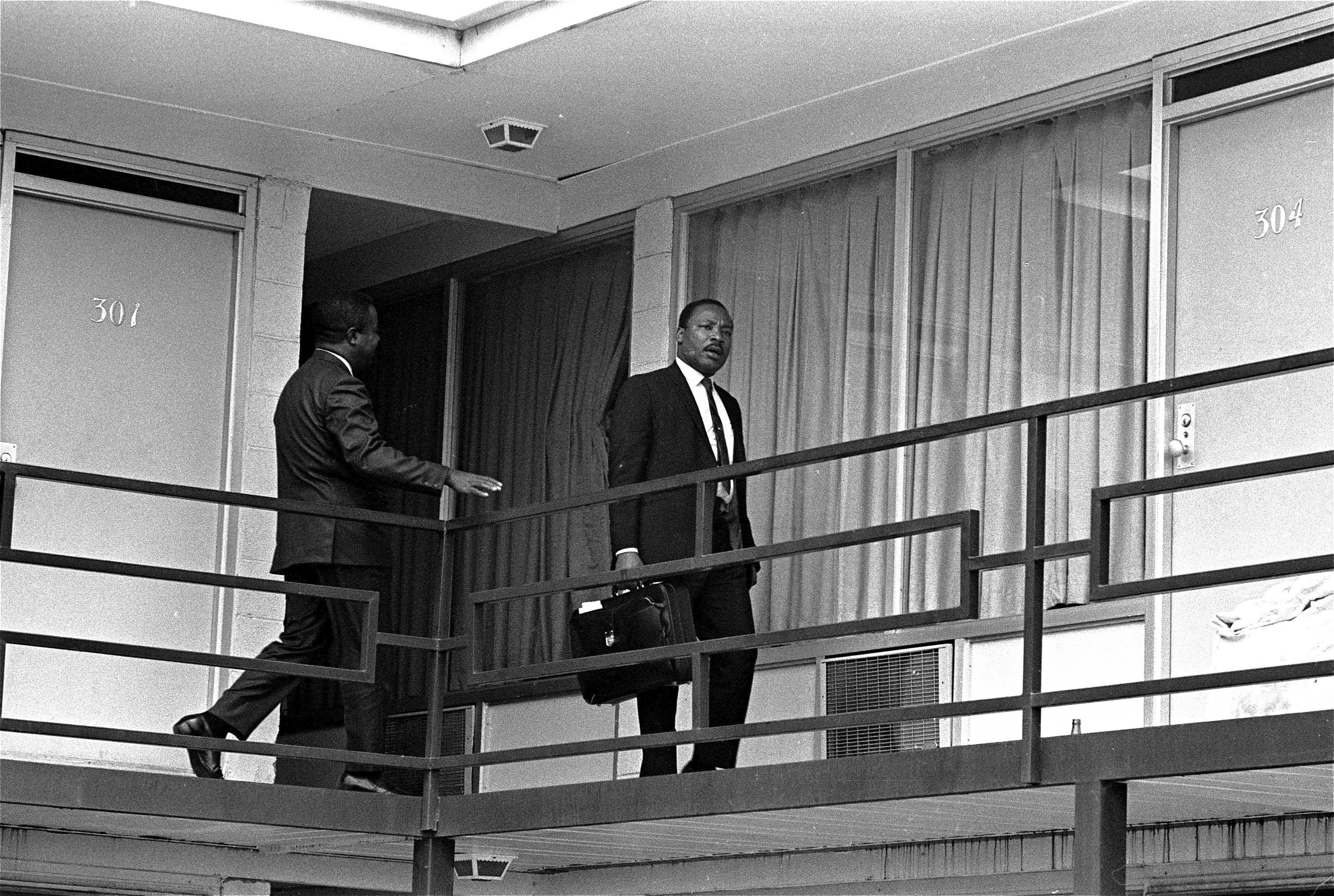 Reverend Martin Luther King Jr walks across the balcony of the Lorraine Motel in Memphis on April 3 in 1968.
