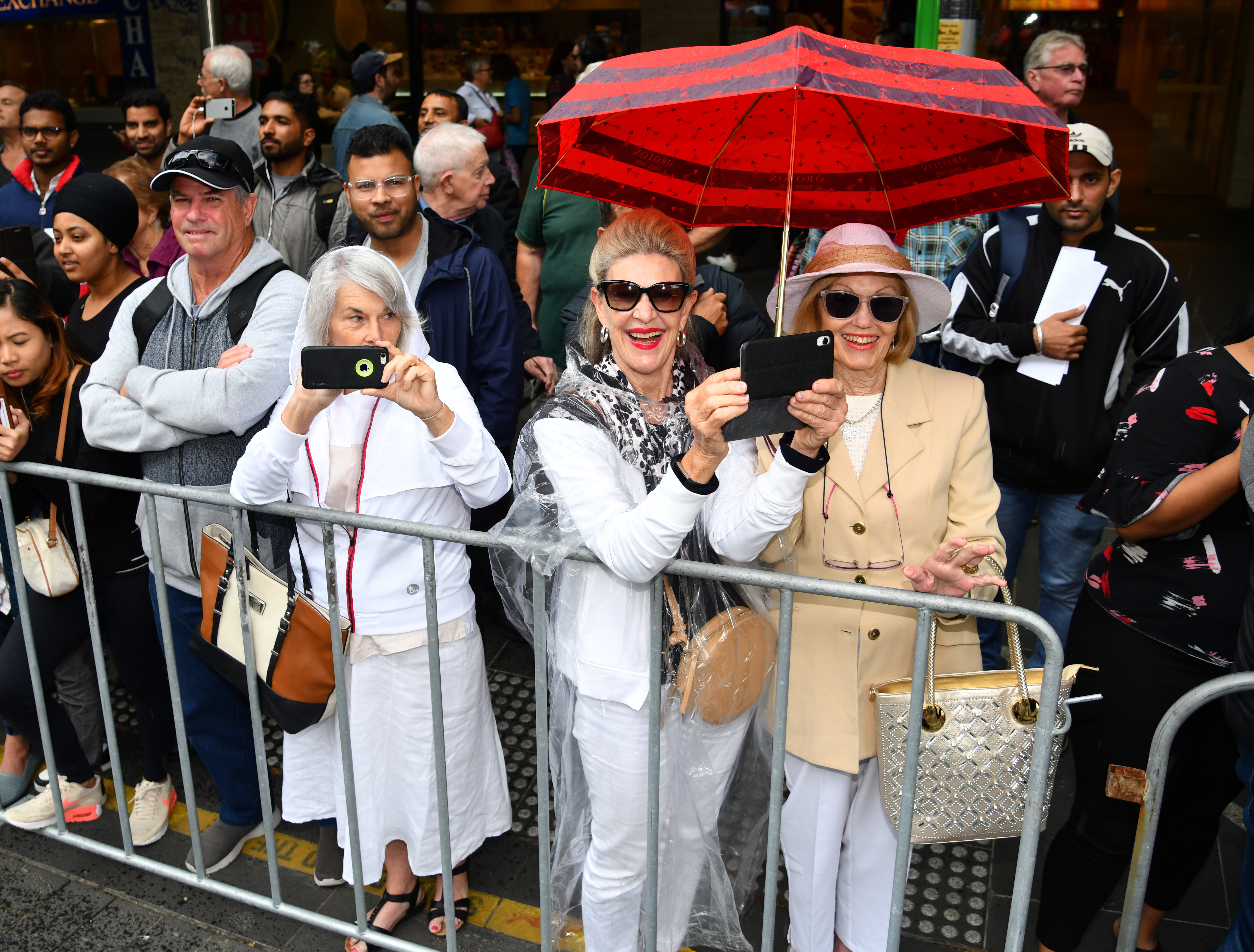 People line the streets to watch the excitement of the Melbourne Cup Parade.