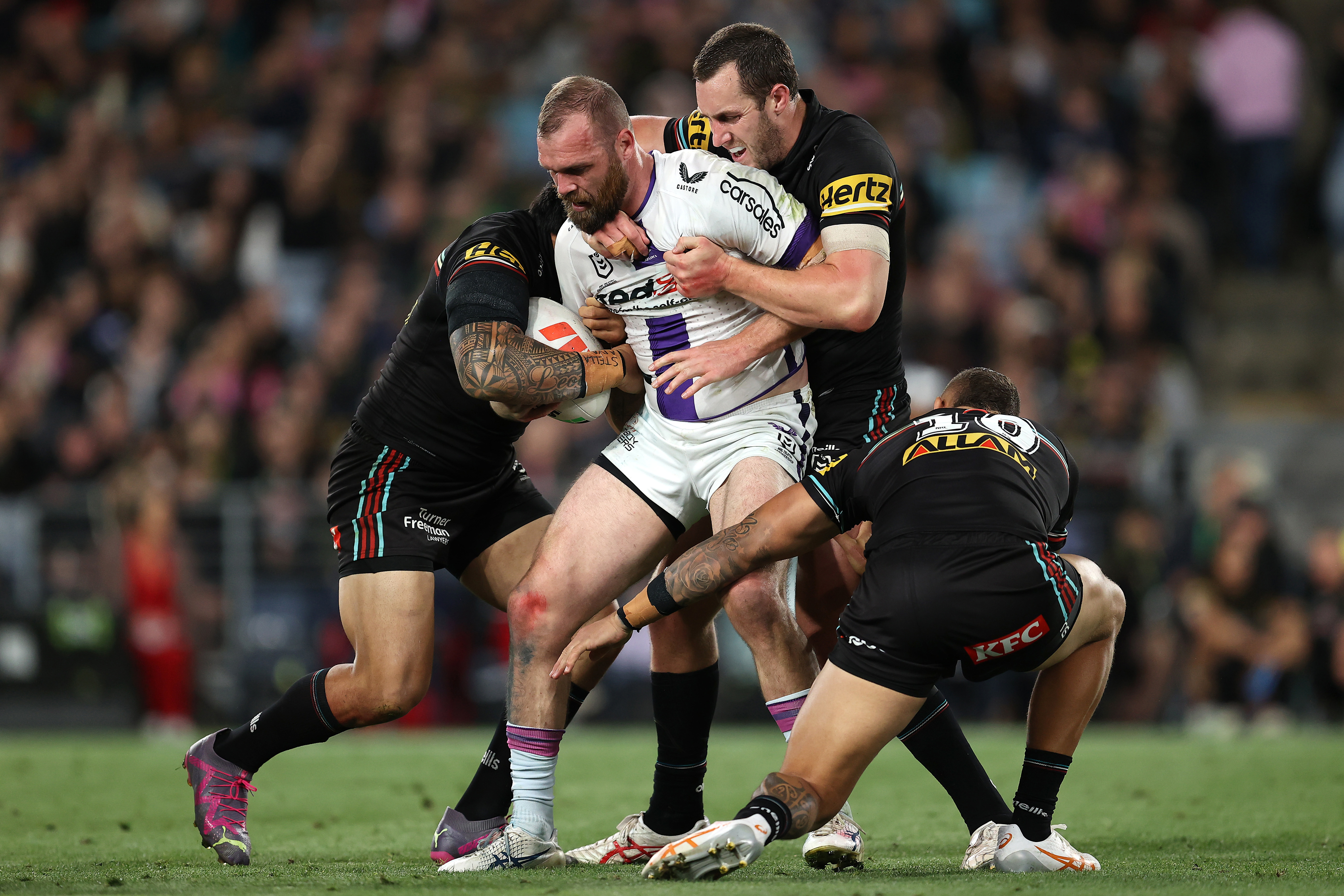 Tom Eisenhuth is tackled during the 2023 preliminary final between the Penrith Panthers and Melbourne Storm.