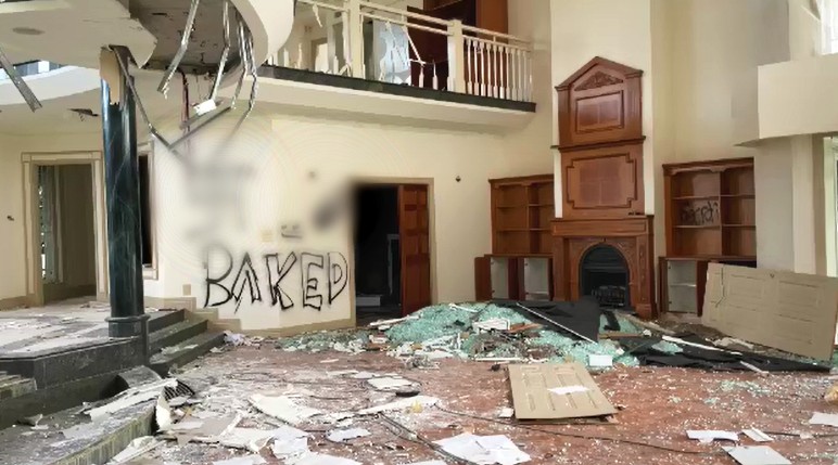 An abandoned Gold Coast mansion has been turned into a shadow of its former self, becoming a haven for squatters, drug addicts thieves, all while becoming a headache for neighbours. 