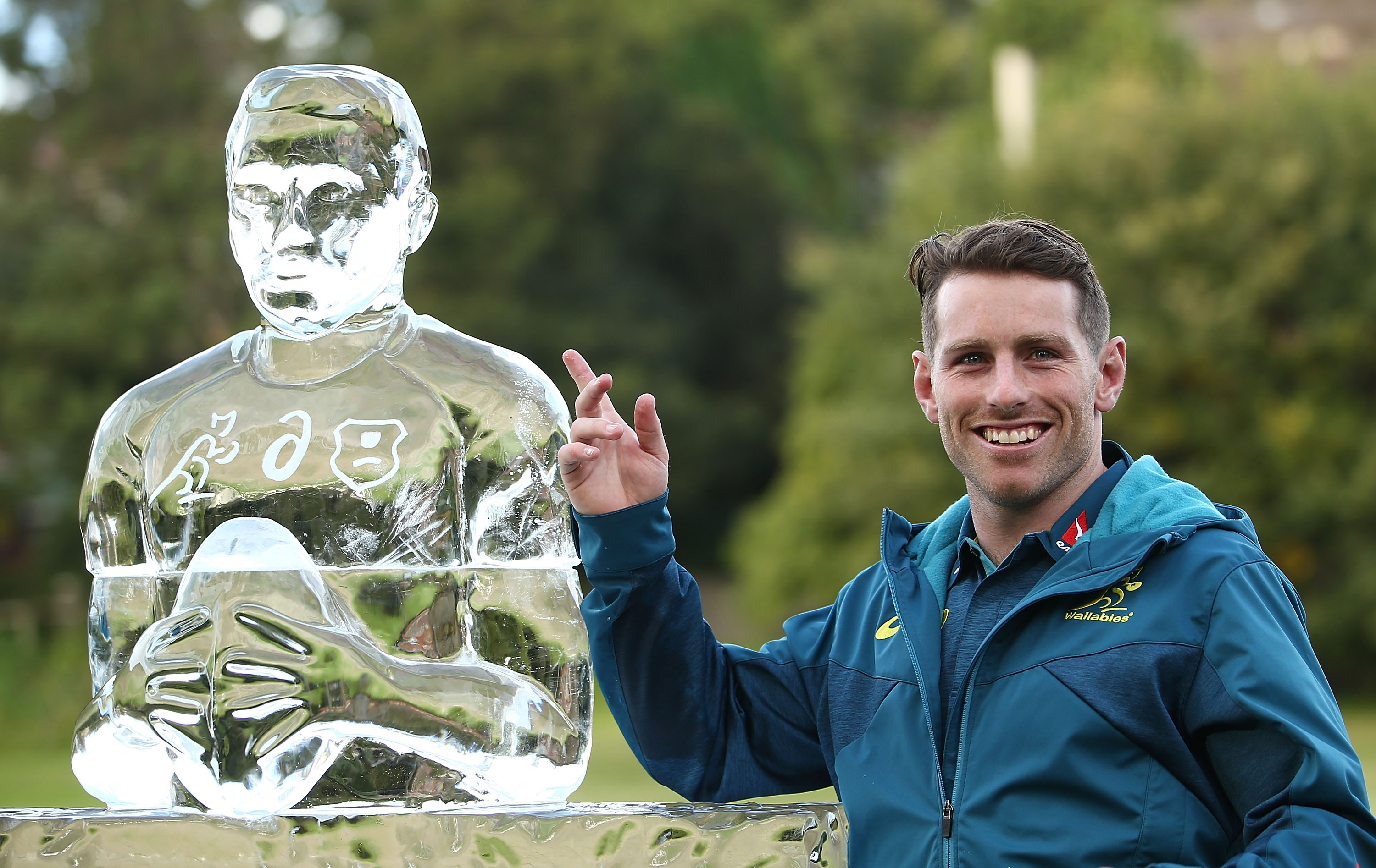 Bernard Foley with an 'Iceman' sculpture made in his honour.
