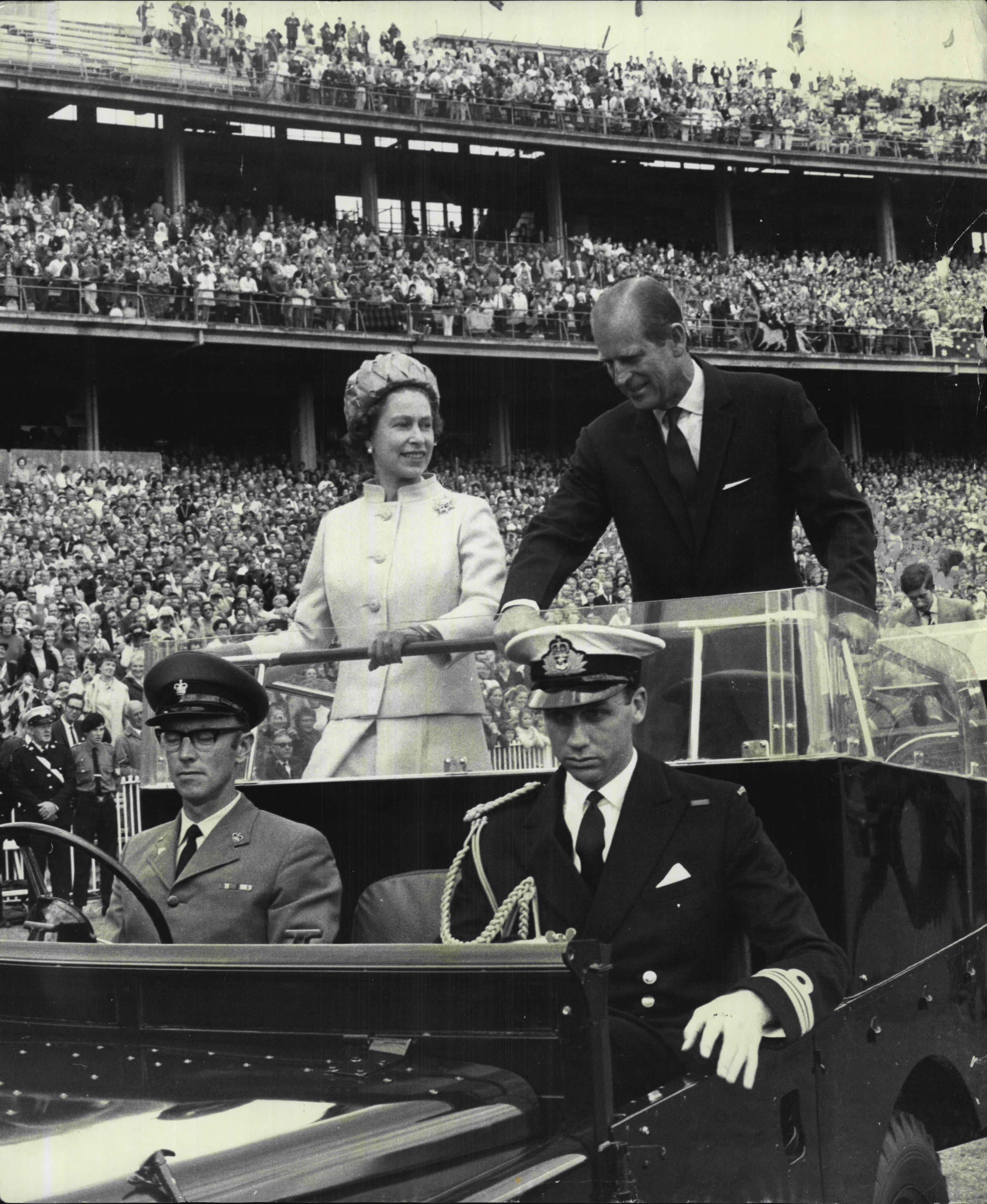 The Queen and the Duke of Edinburgh pictured during their 1970 tour at the Melbourne Cricket Ground in an open car. The royal pair stayed to watch an Australian Rules match between Richmond and Fitzroy.