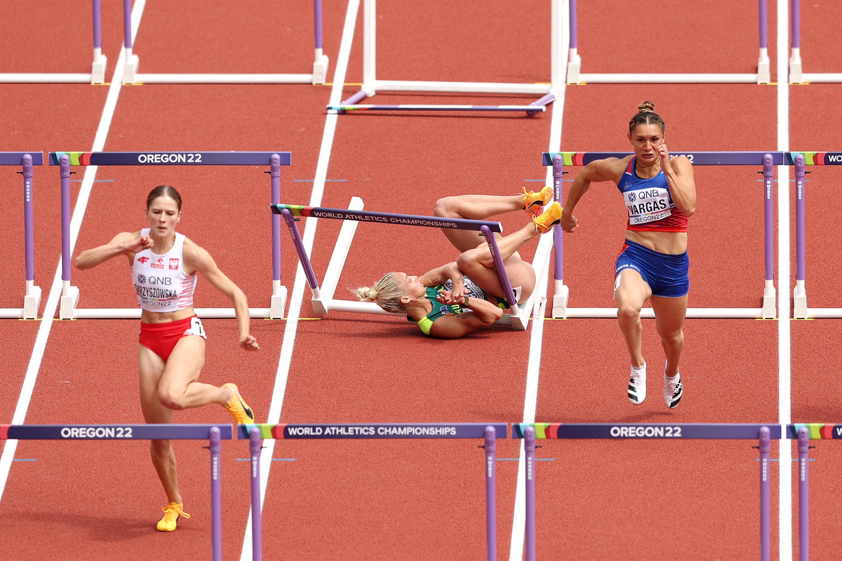 Liz Clay falls during the women's 100m hurdles heats.
