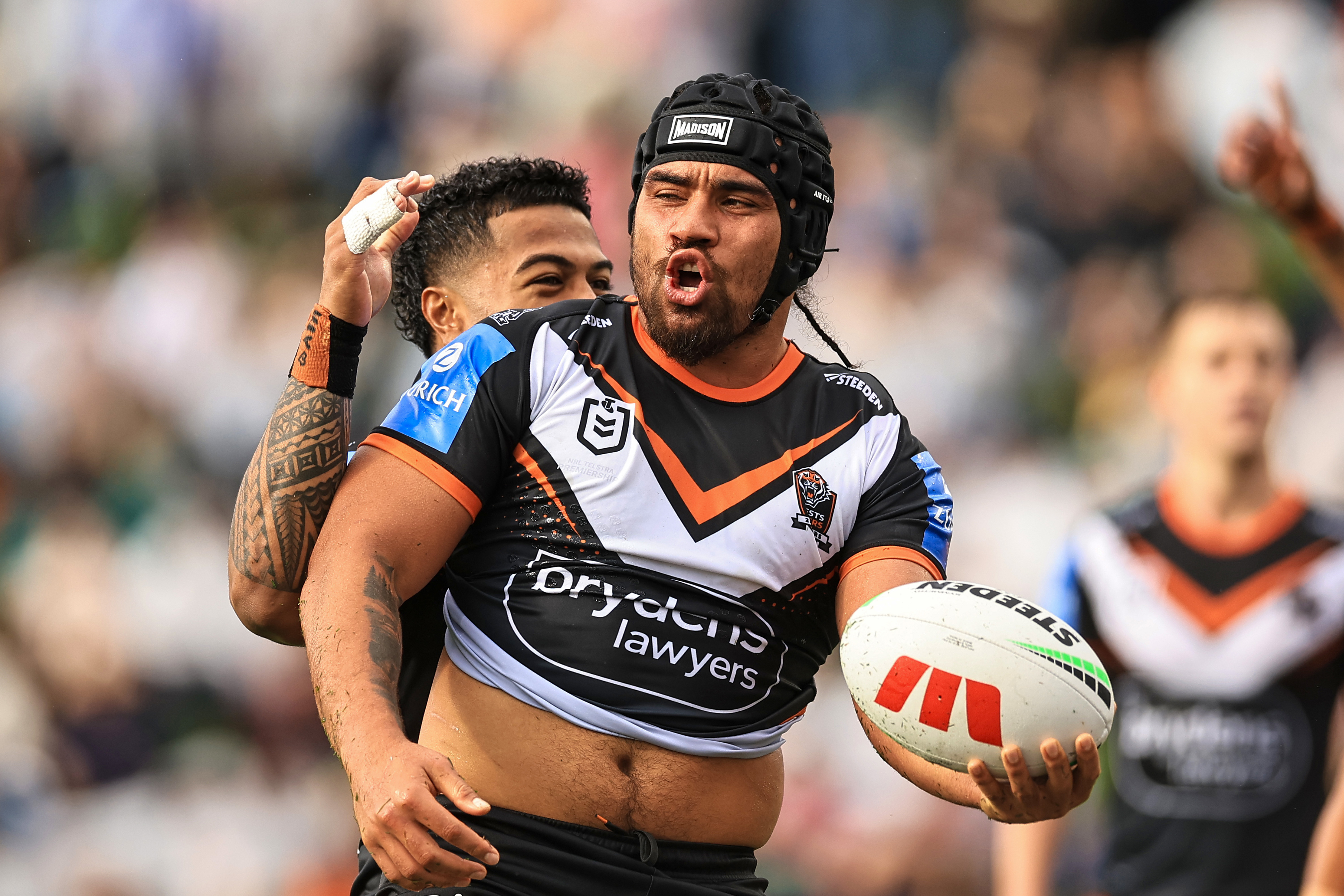 Isaiah Papali'i of the Tigers celebrates a try.