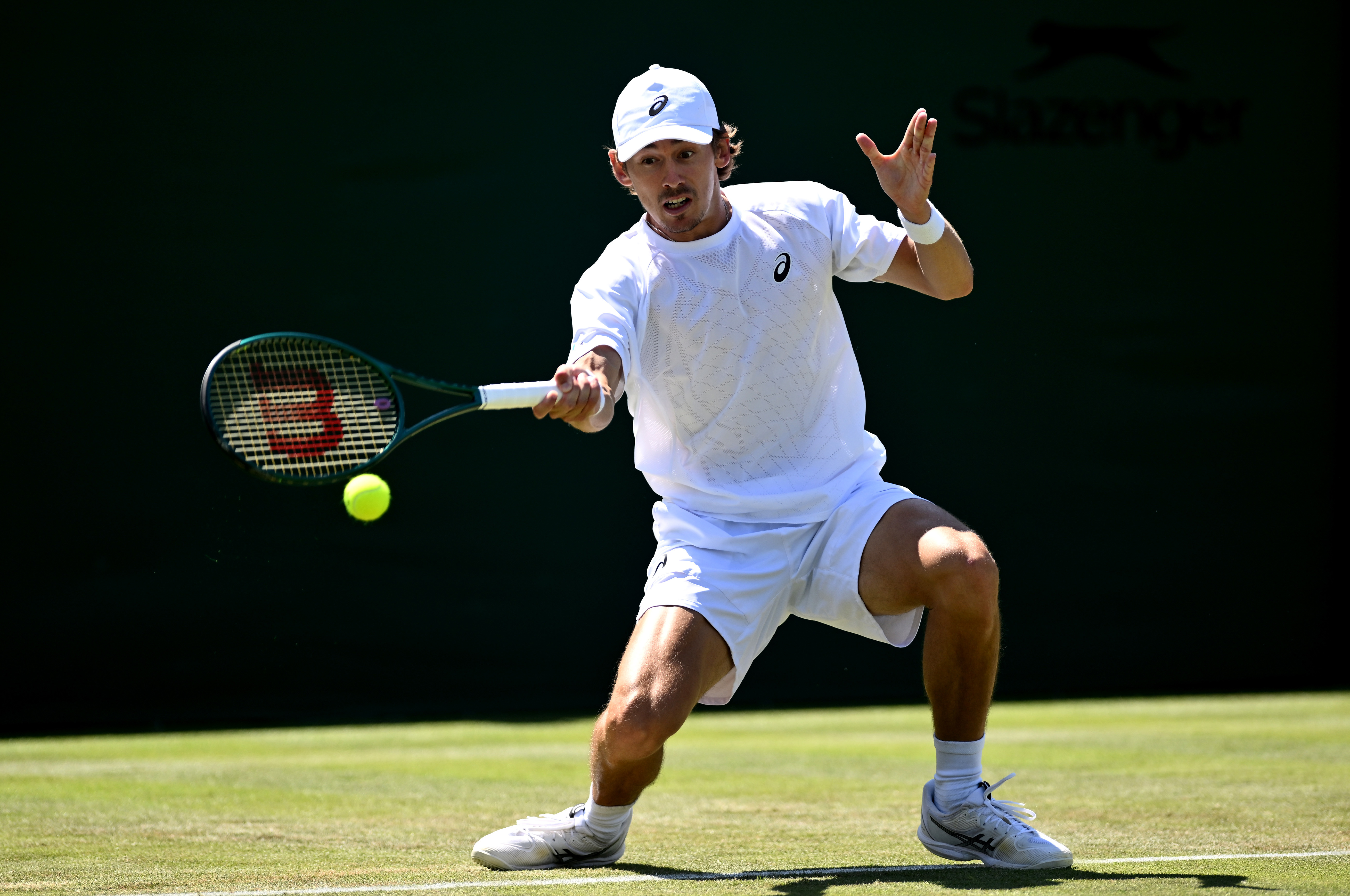 Alex de Minaur plays a forehand against Arthur Cazaux.