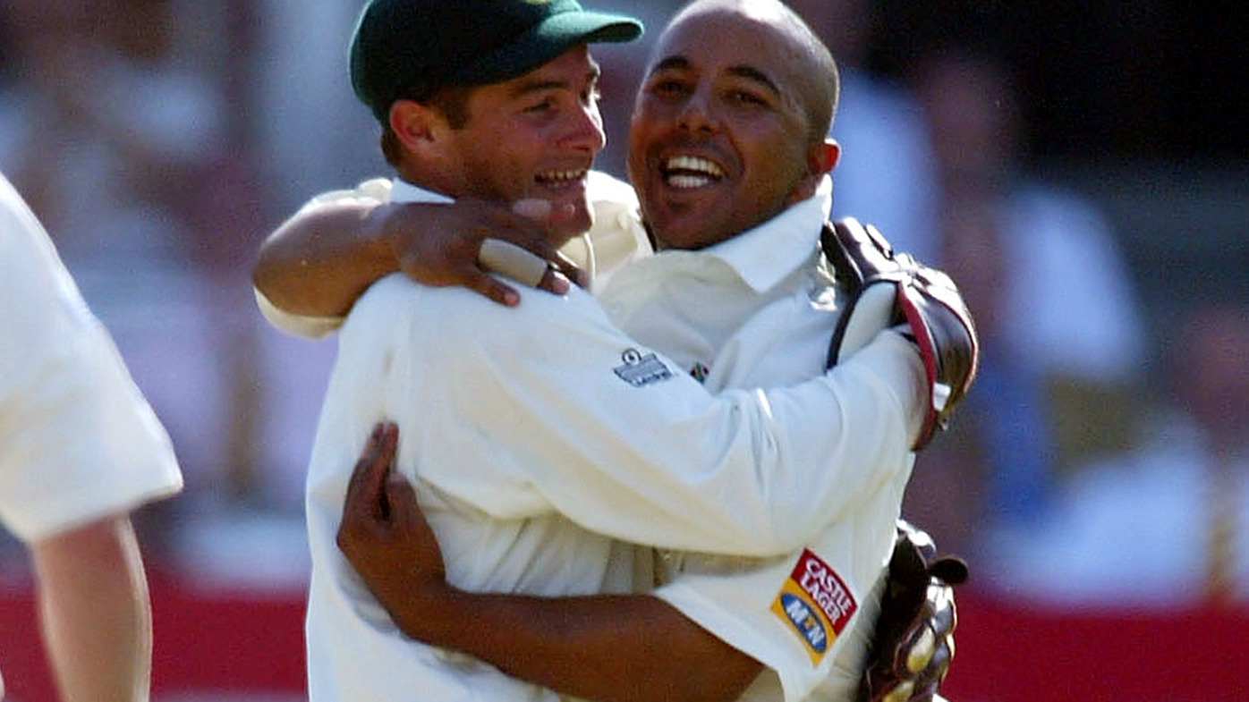 Mark Boucher and Paul Adams celebrate a wicket in a Test against England.