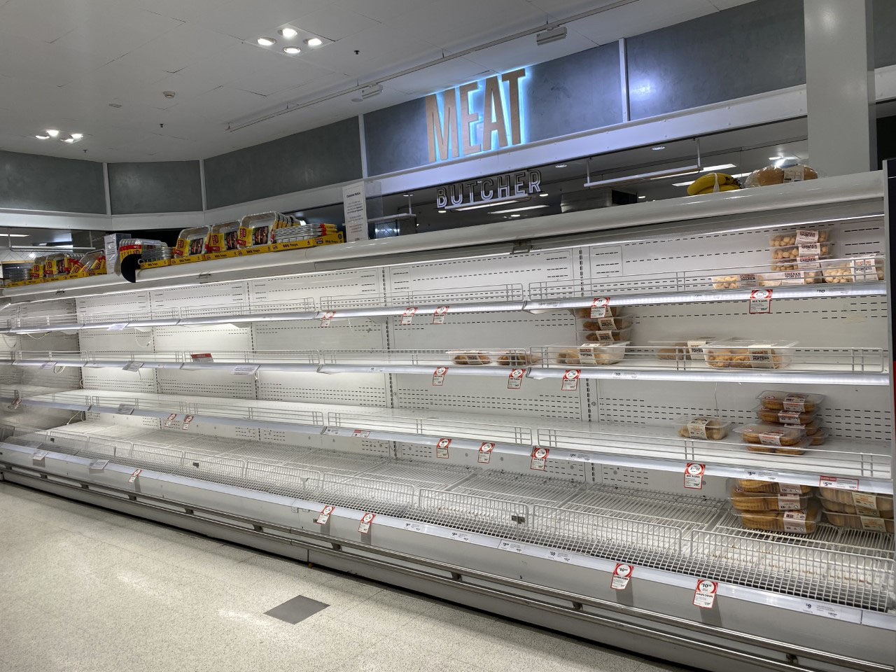 Empty supermarket shelves at Coles