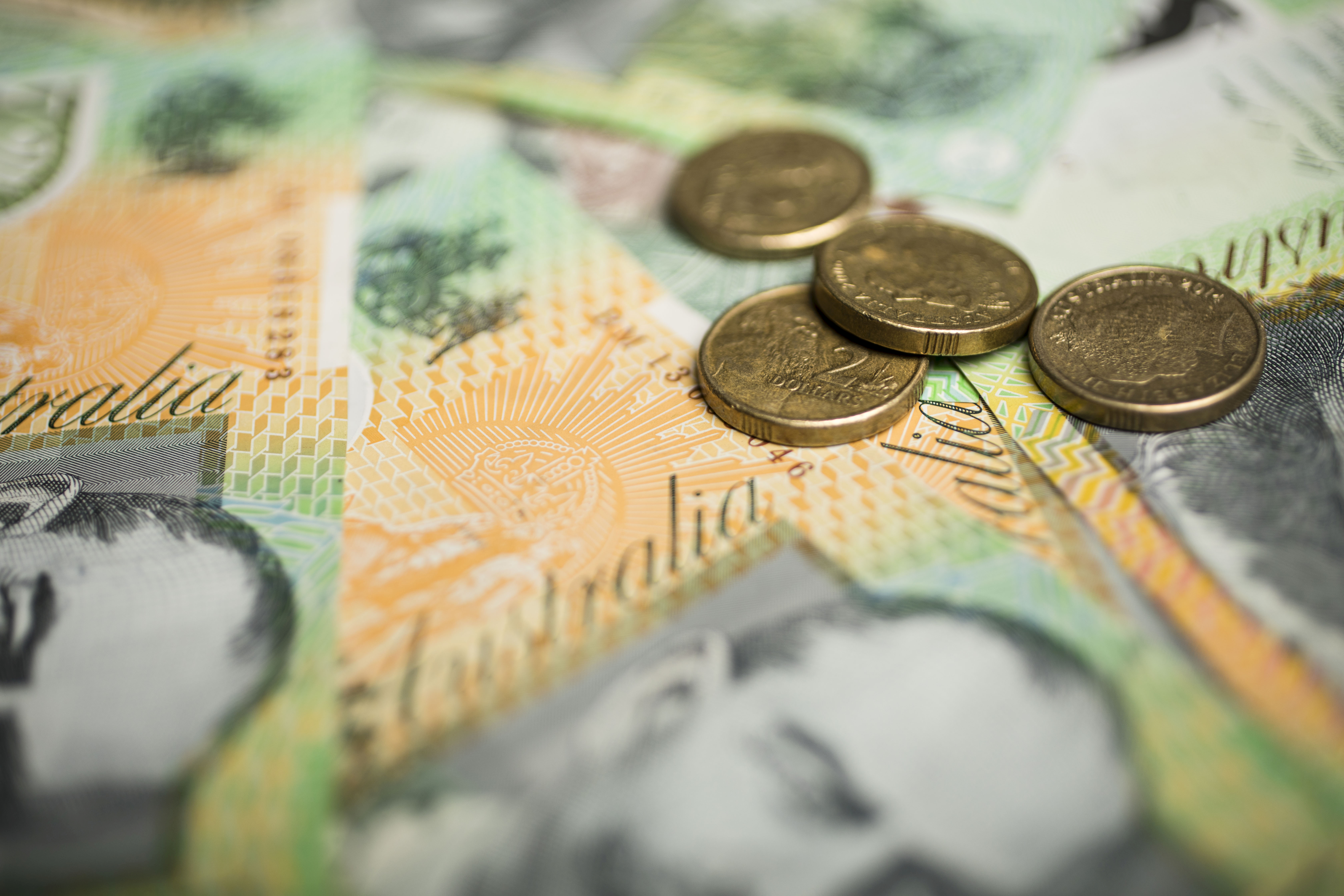 A generic picture of Australian money - $2 coins on top of $100 notes.