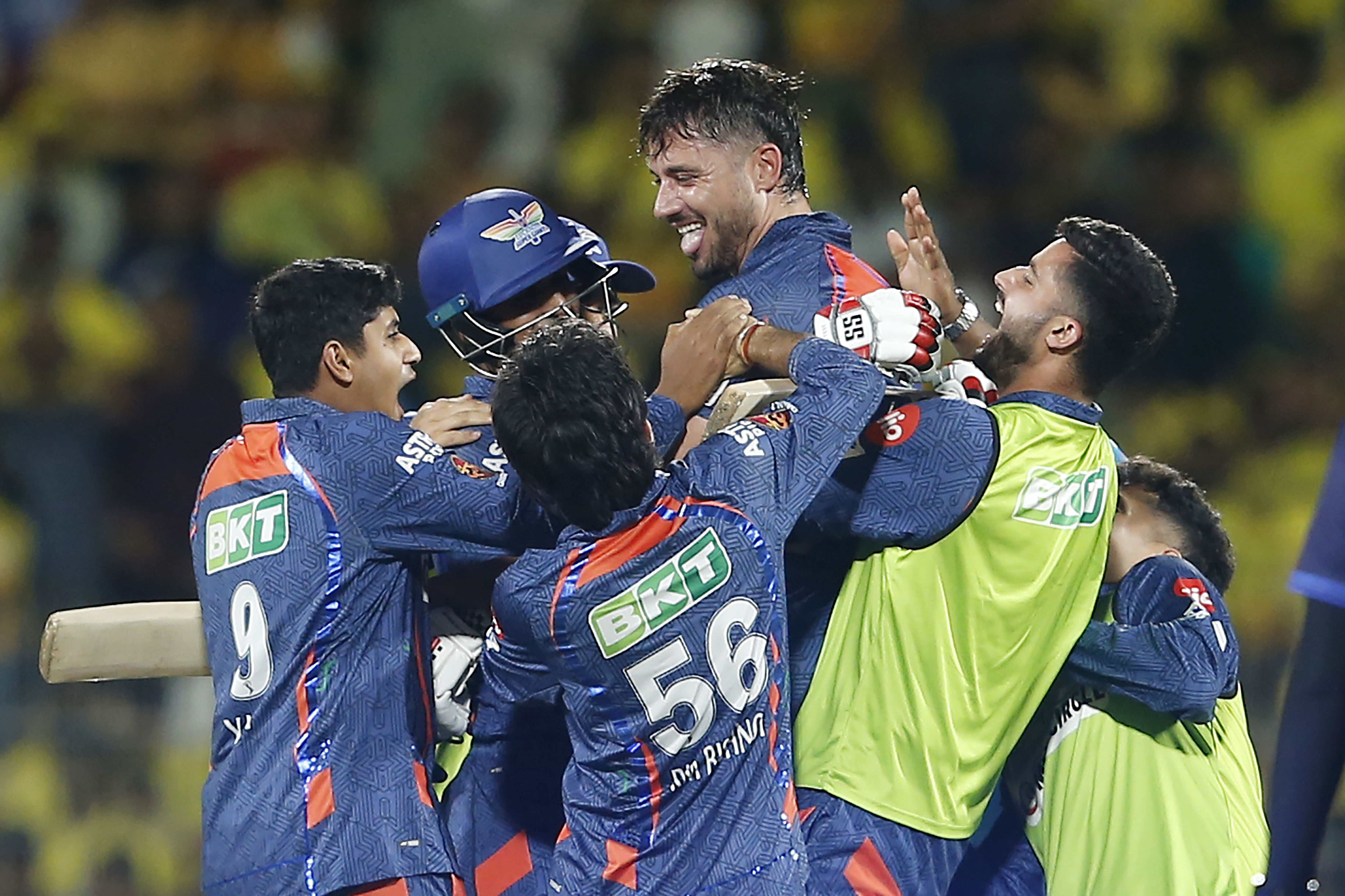 Lucknow Super Giants' team members lift Marcus Stoinis as they celebrate their win in the Indian Premier League over the Chennai Super Kings.