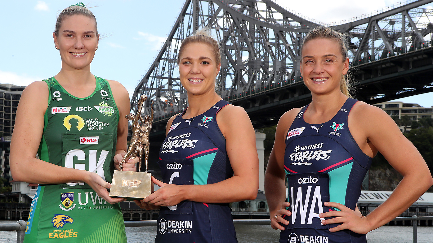 West Coast Fever captain Courtney Bruce and Melbourne Vixens co-captains Kate Moloney and Liz Watson pose with the Super Netball trophy