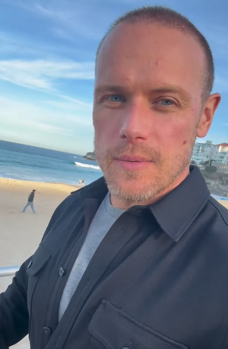 Sam Heughan walks along Bondi Beach in Sydney, June 2025