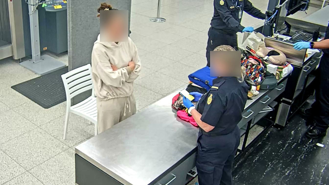 The traveller is pictured after her arrival at Perth airport.