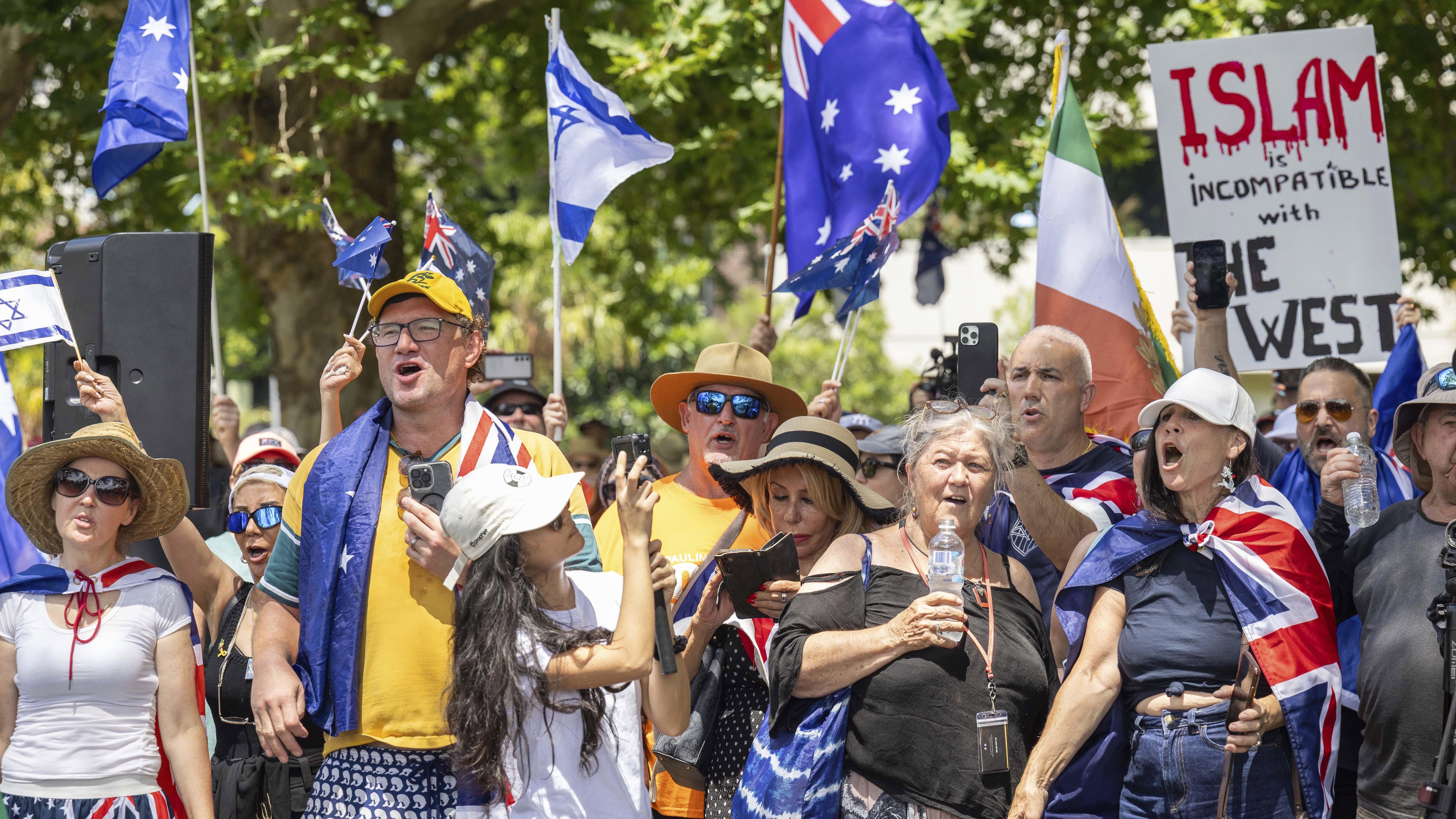 People participate in an anti-immigration, 'Put Australia First,' rally at Prince Alfred Park, Sydney.