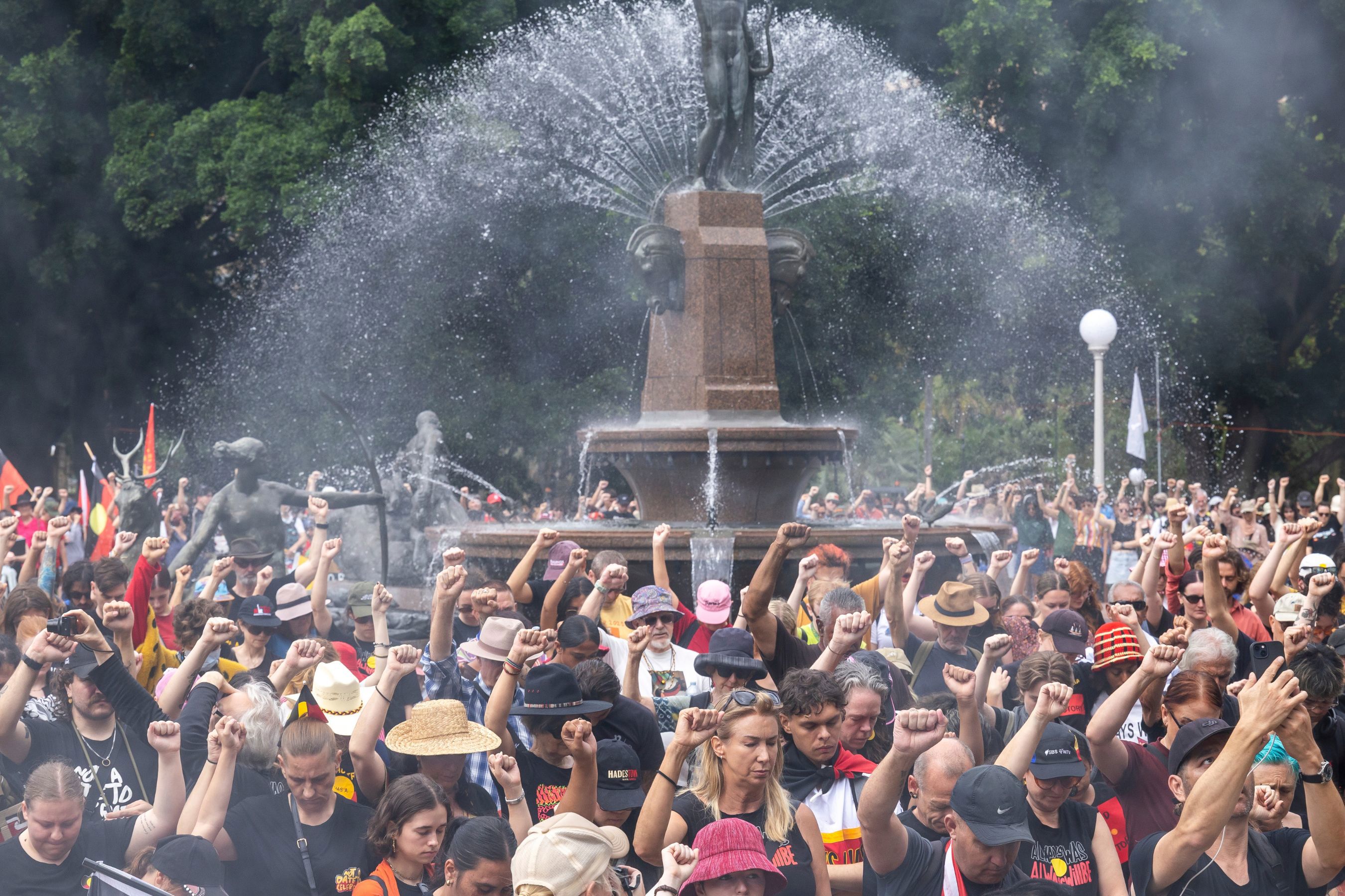 People observe a minute of silence for Sophie Quinn, Nerida Quinn, and John Harris, who were fatally shot at Lake Cargelligo on Thursday, at the Invasion Day rally in Hyde Park. Monday 26th January 2026. Photo: Sitthixay Ditthavong