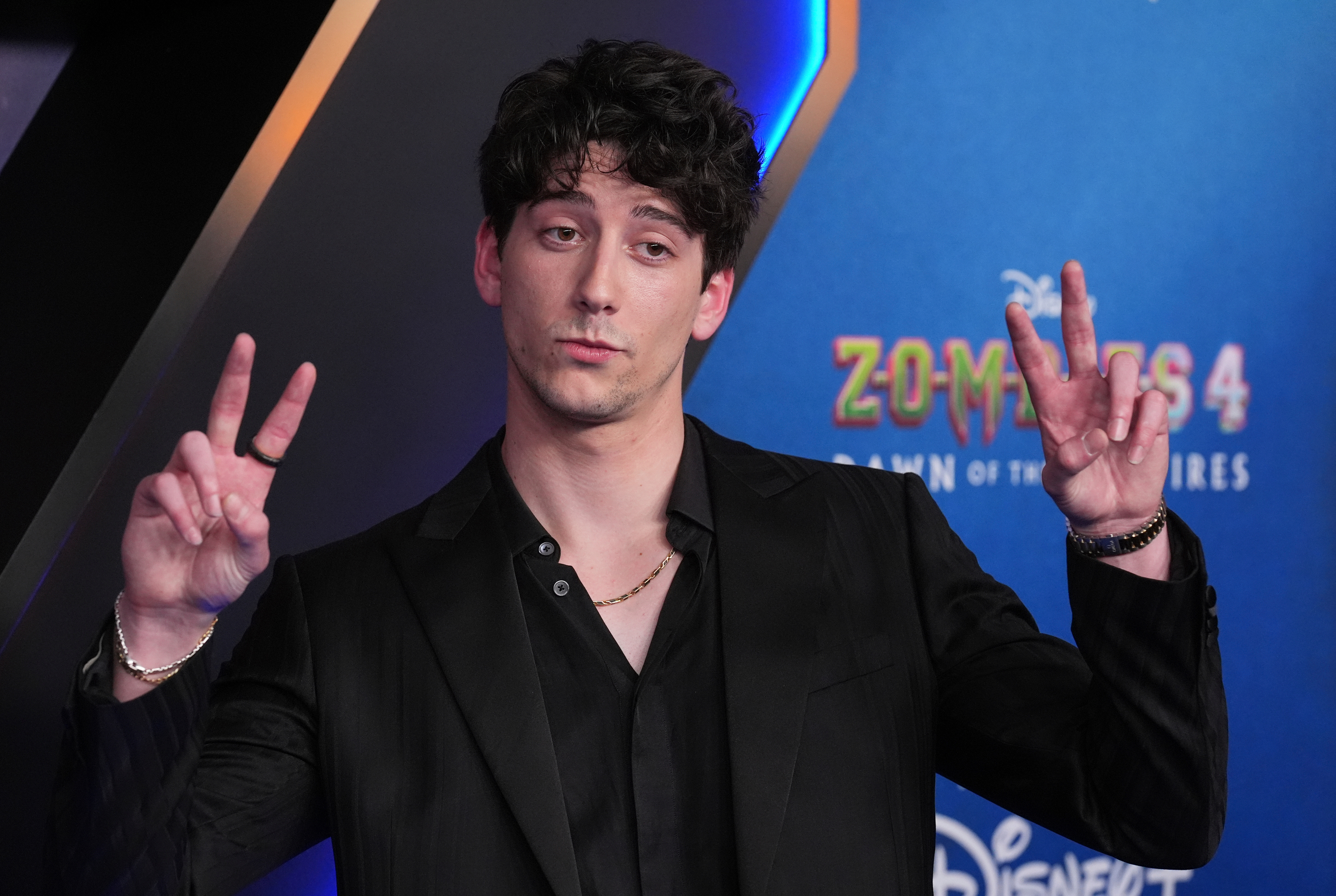 Milo Manheim arrives at the premiere of Zombies 4 on July 8, 2025, at El Capitan Theatre in Los Angeles.