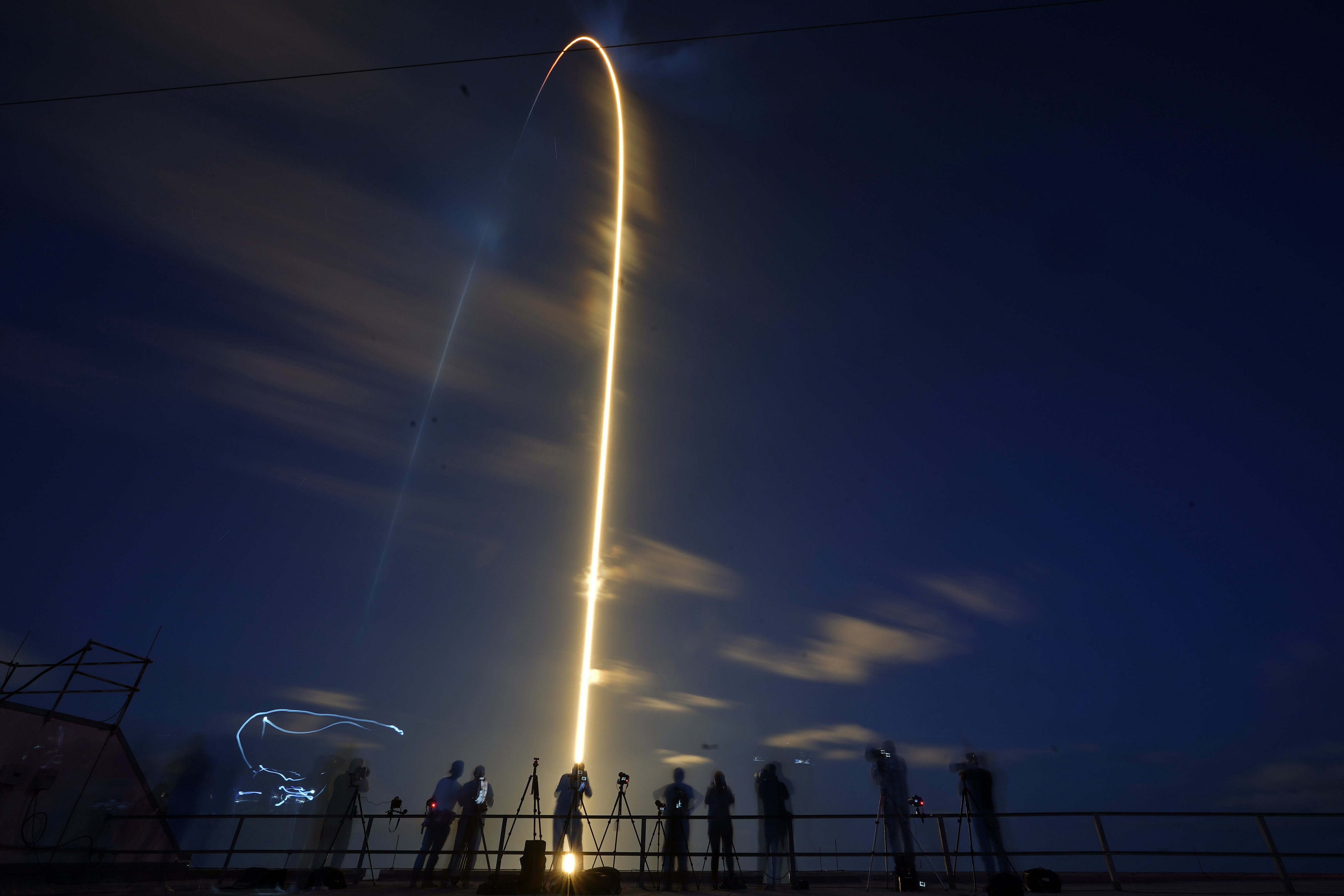 A SpaceX Falcon 9 rocket, with four private citizens onboard, lifts off in this time-exposure photo from Kennedy Space Center's Launch Pad 39-A, Wednesday, Sept. 15, 2021, in Cape Canaveral, Fla. (AP Photo/John Raoux)