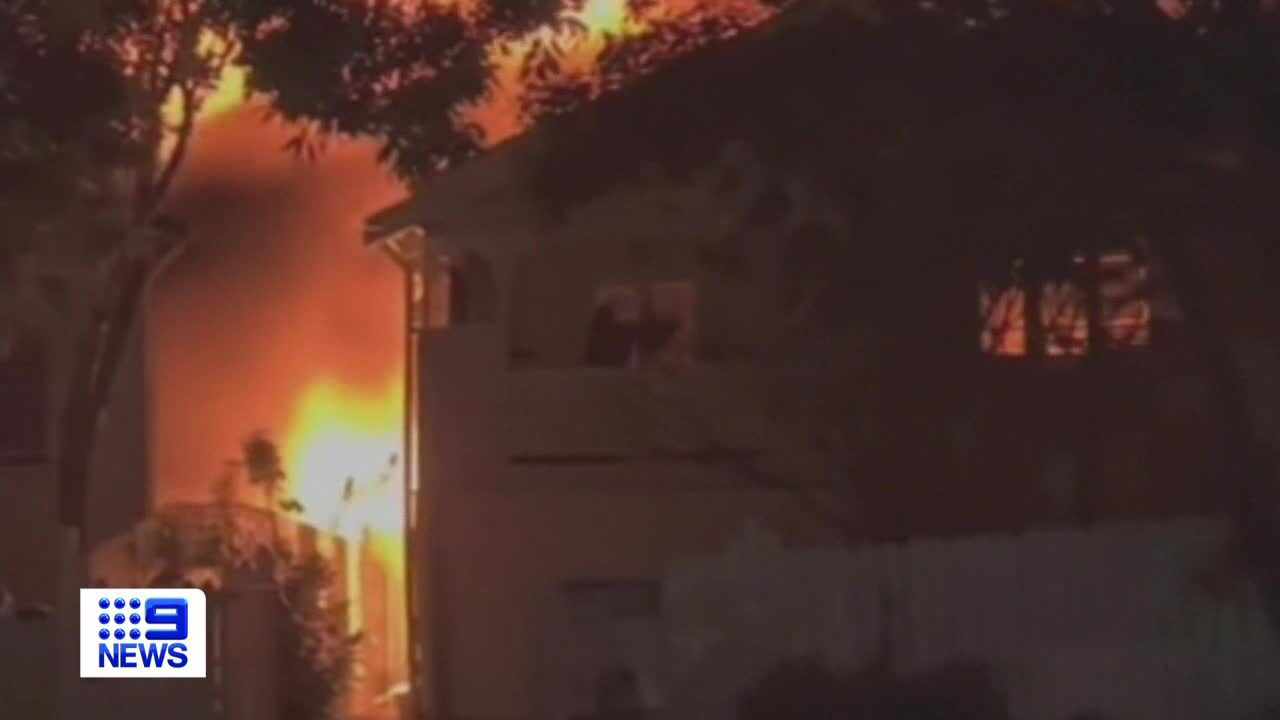 In footage one man can be seen smashing glass, desperately trying to get everyone out of the houses in Forbes Street in Hawthorne in the city's east.