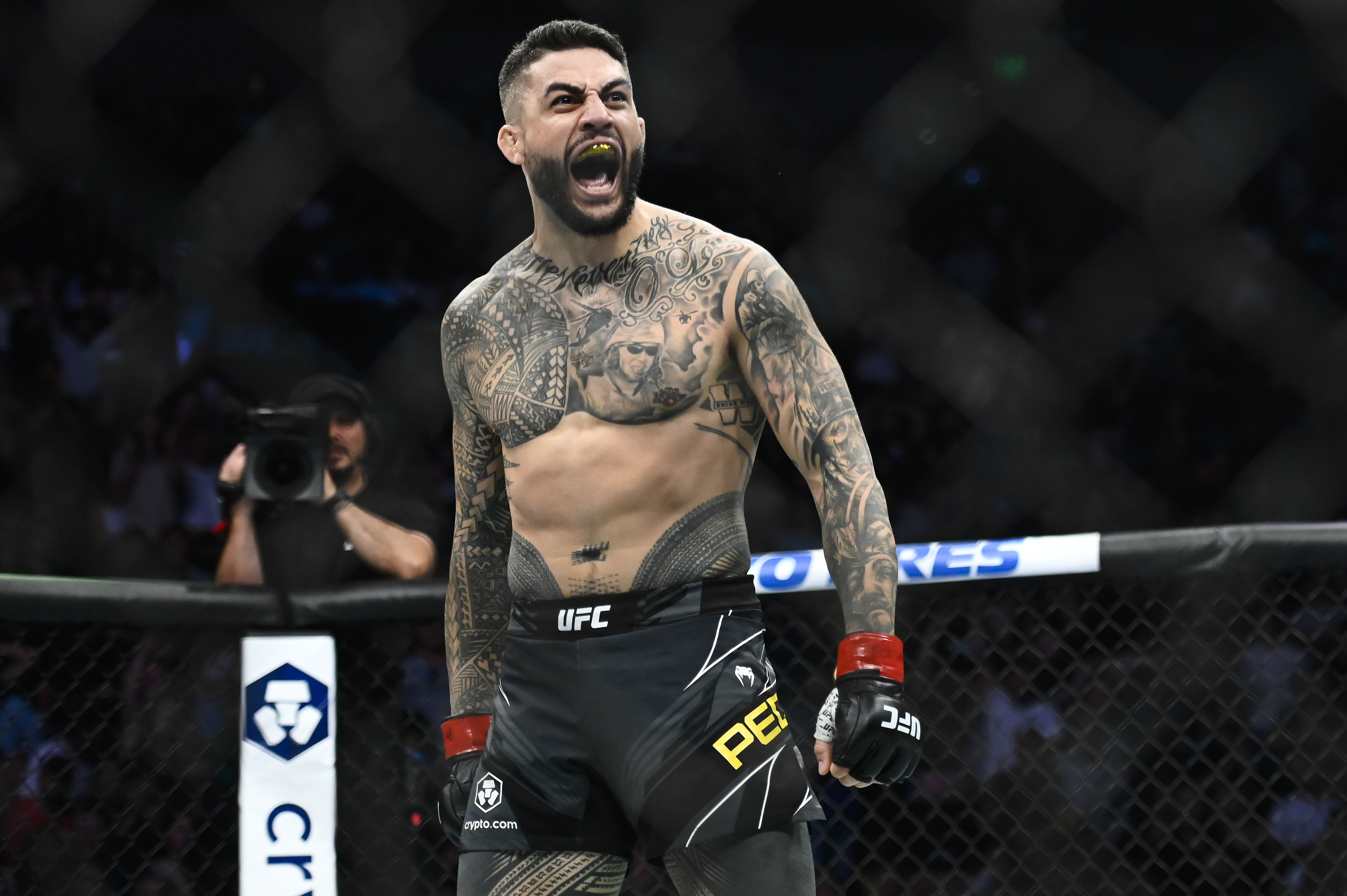 Tyson Pedro of Australia celebrates after defeating Harry Hunsucker during UFC 278.