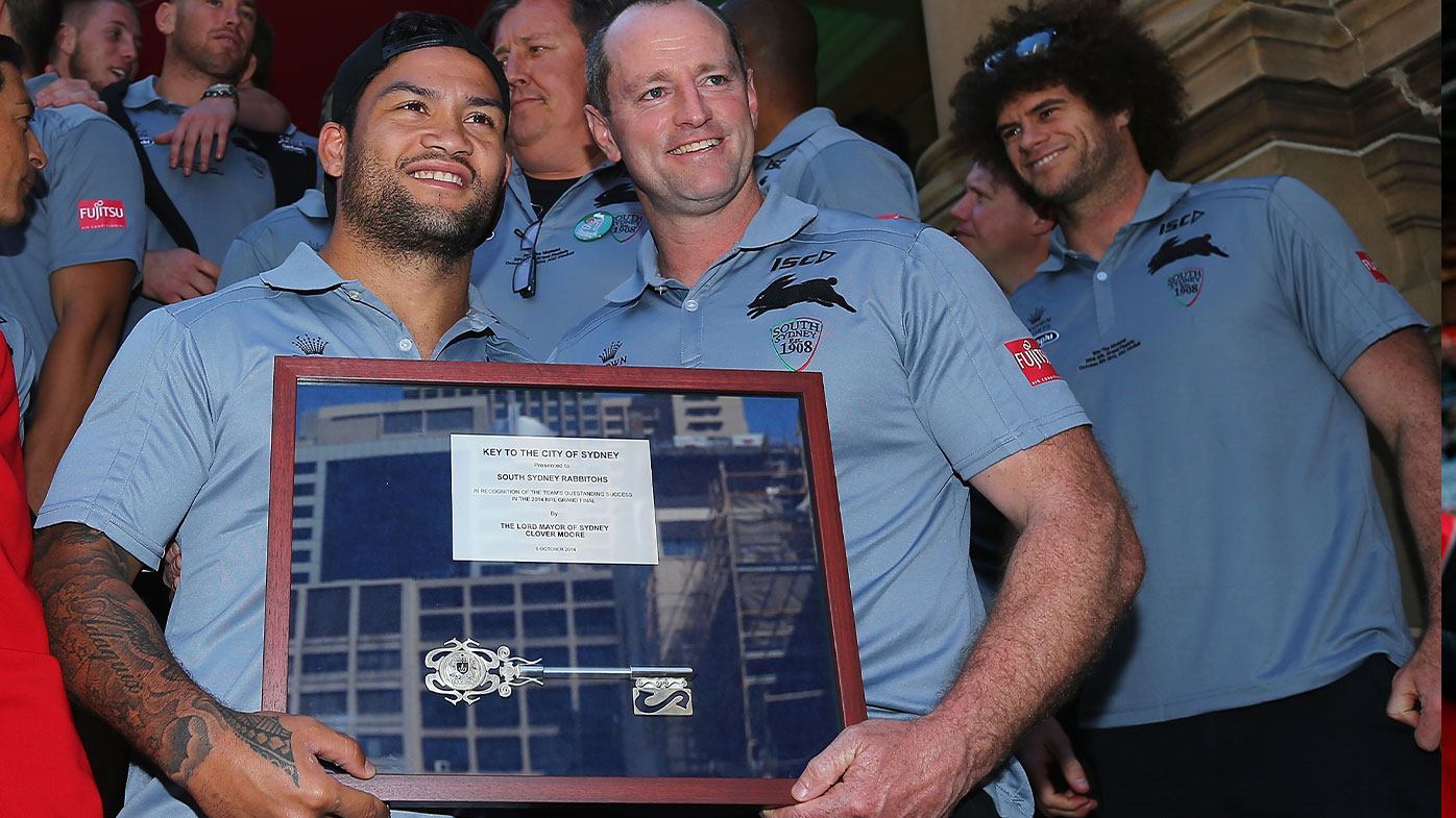 Issac Luke and former Souths coach Michael Maguire pose with the "Key to the City" during a South Sydney Rabbitohs NRL Grand Final celebration 