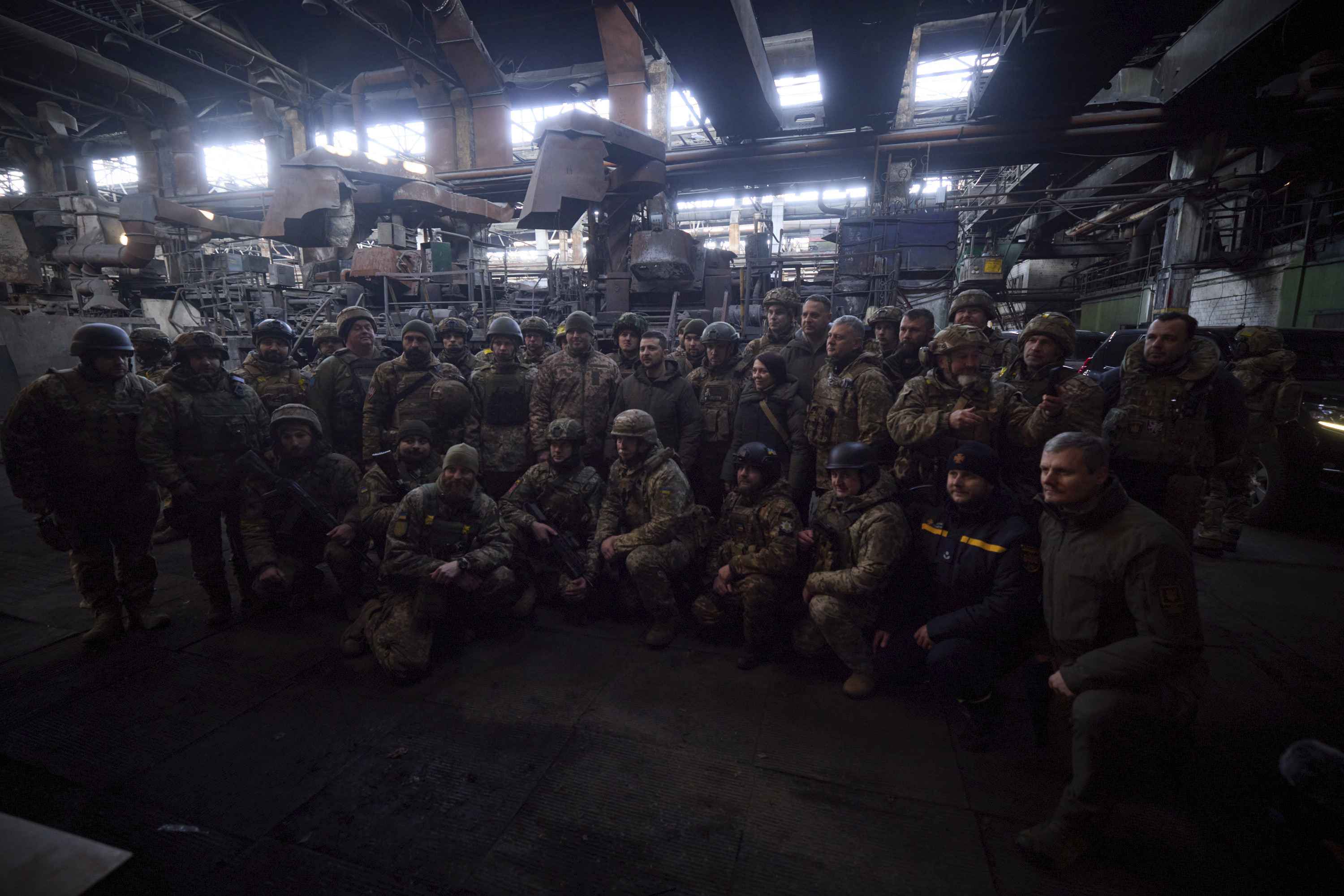 Ukrainian President Volodymyr Zelenskyy, centre, poses for photo with soldiers at the site of the heaviest battles with the Russian invaders in Bakhmut, Ukraine, Tuesday, Dec. 20, 2022. 