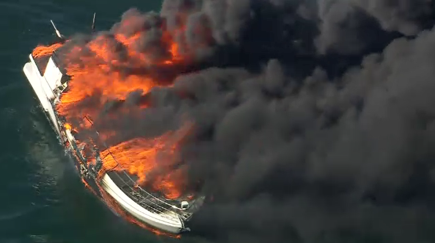 A boat is on fire in Port Phillip﻿, south of Melbourne's city centre, sending plumes of black smoke into the sky.