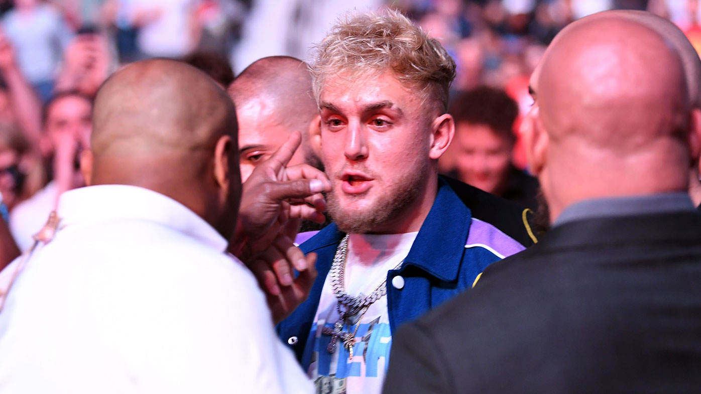  (L-R) Daniel Cormier interacts with Jake Paul during the UFC 261 event at VyStar Veterans Memorial Arena on April 24, 2021 in Jacksonville, Florida. (Photo by Josh Hedges/Zuffa LLC)