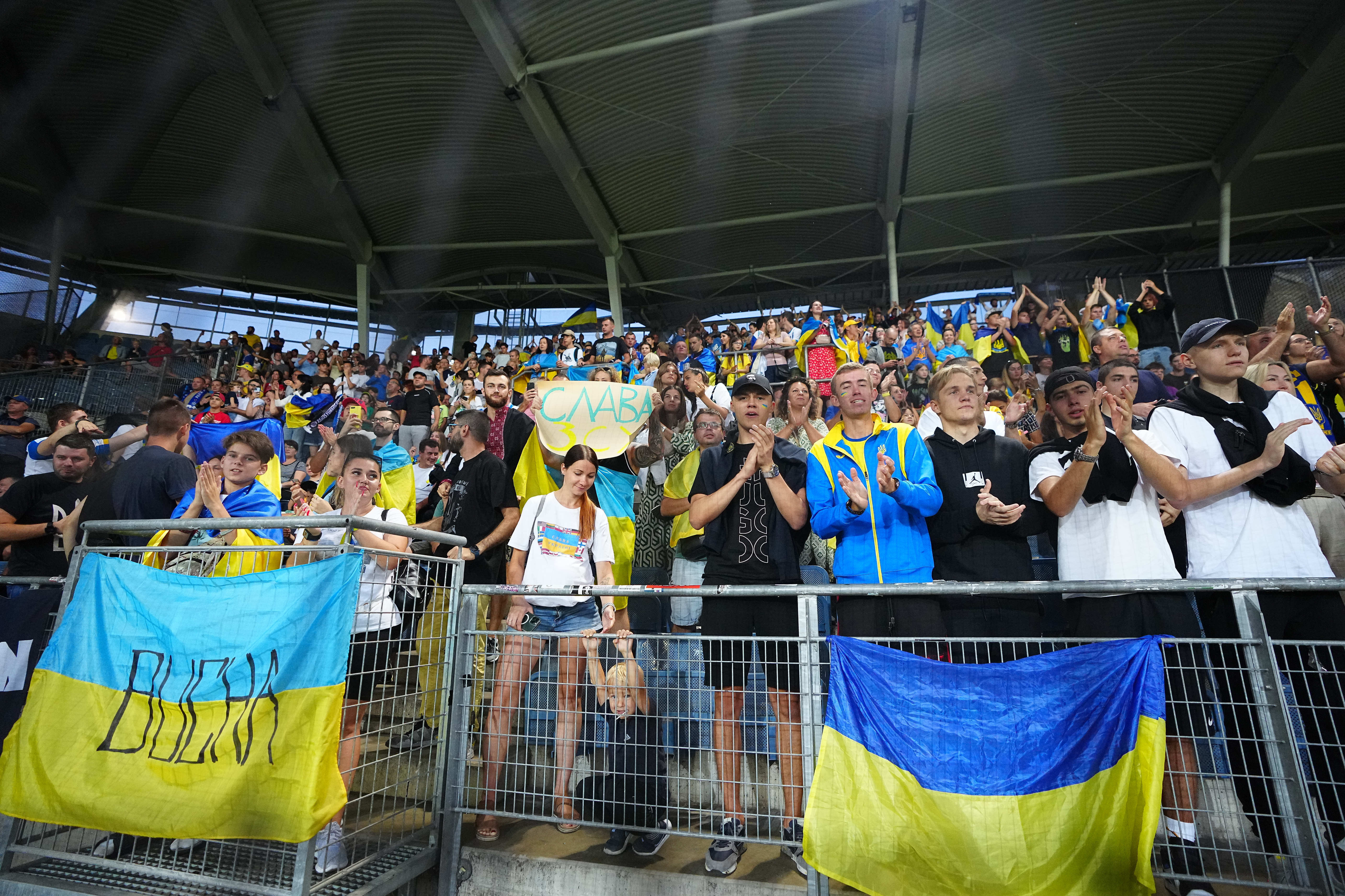Dynamo Kiev fans cheer at Merkur Arena.