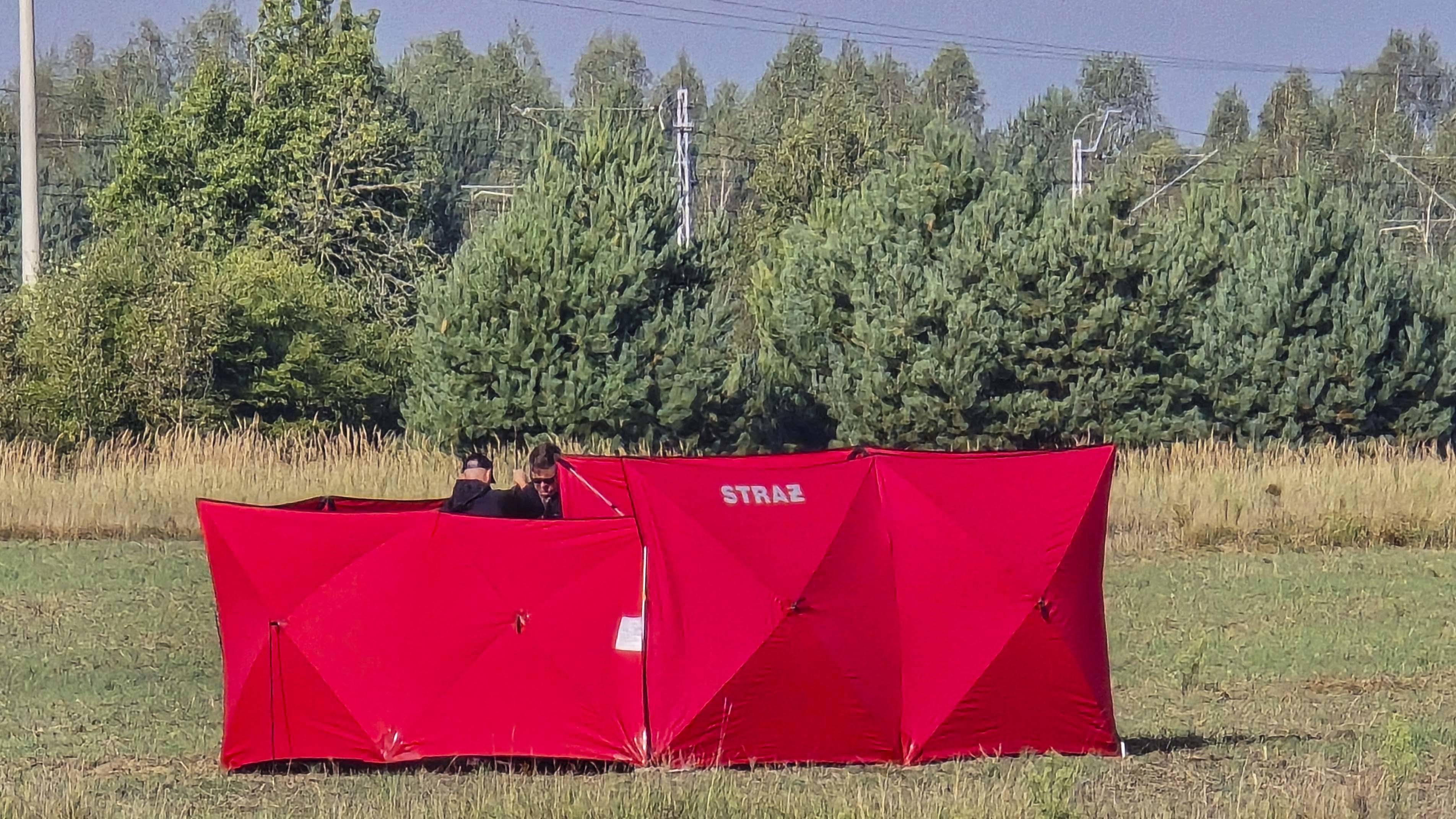 Firefighters secure parts of a damaged UAV shot down by Polish authorities at a site in Czosnowka near Biala Podlaska, Poland.