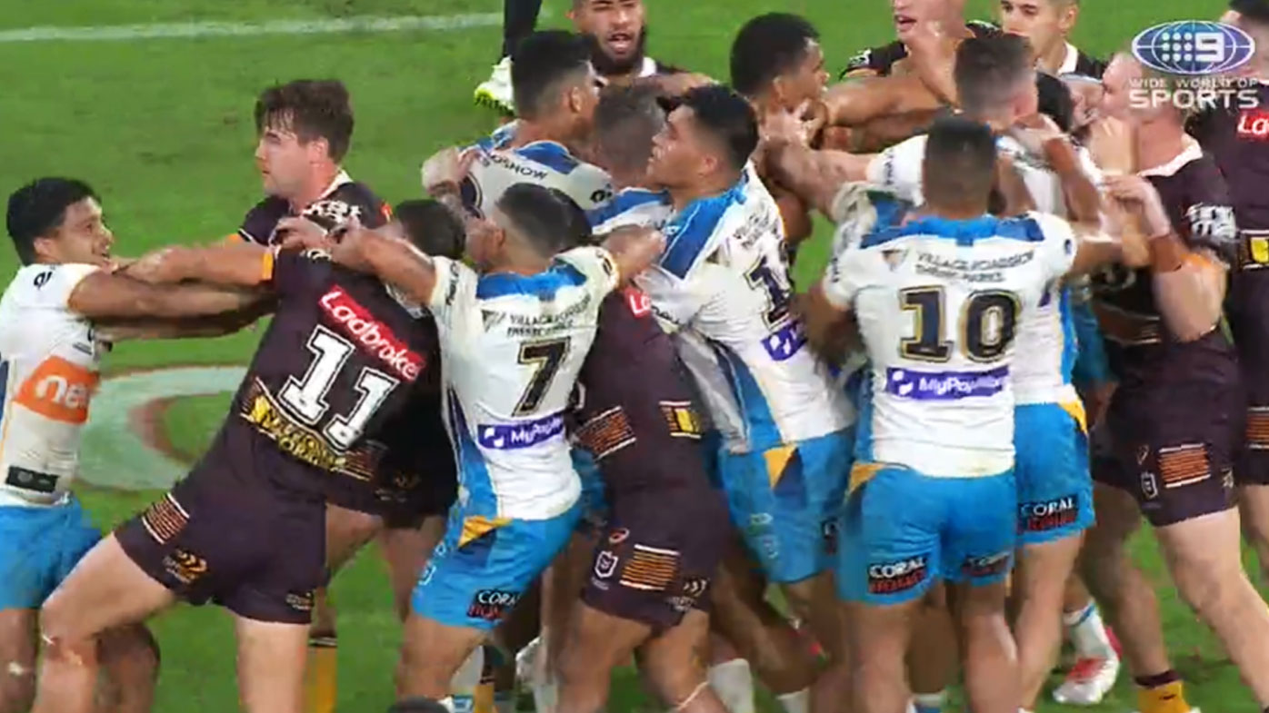 Broncos and the Titans get stuck in at the siren. (Nine)