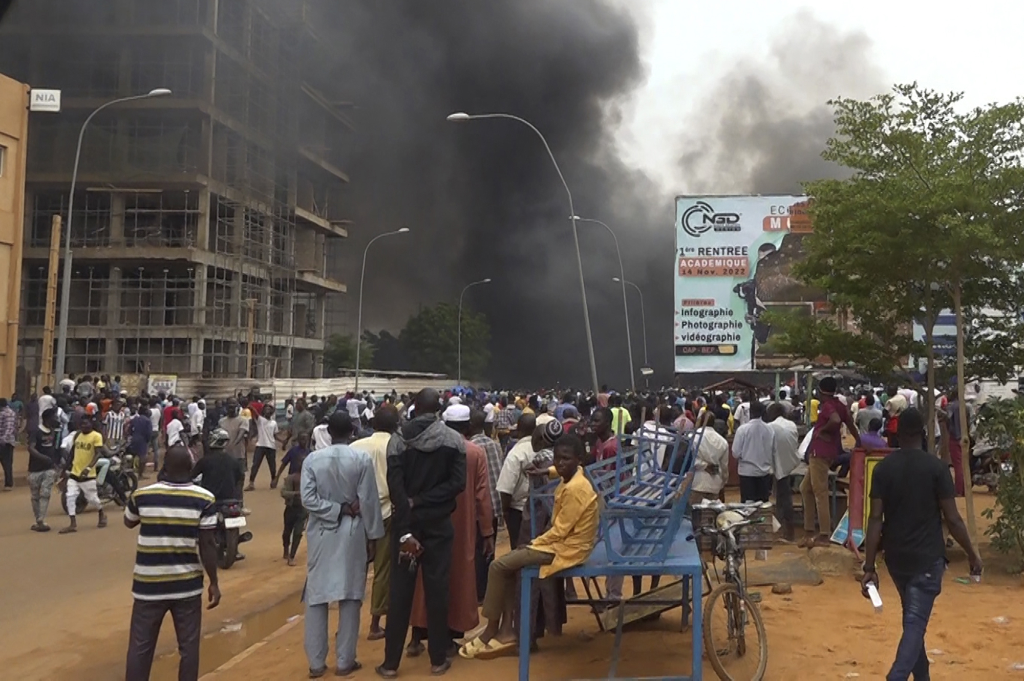 Smoke rises from a government building during a coup in Niger on July 23, 2023.