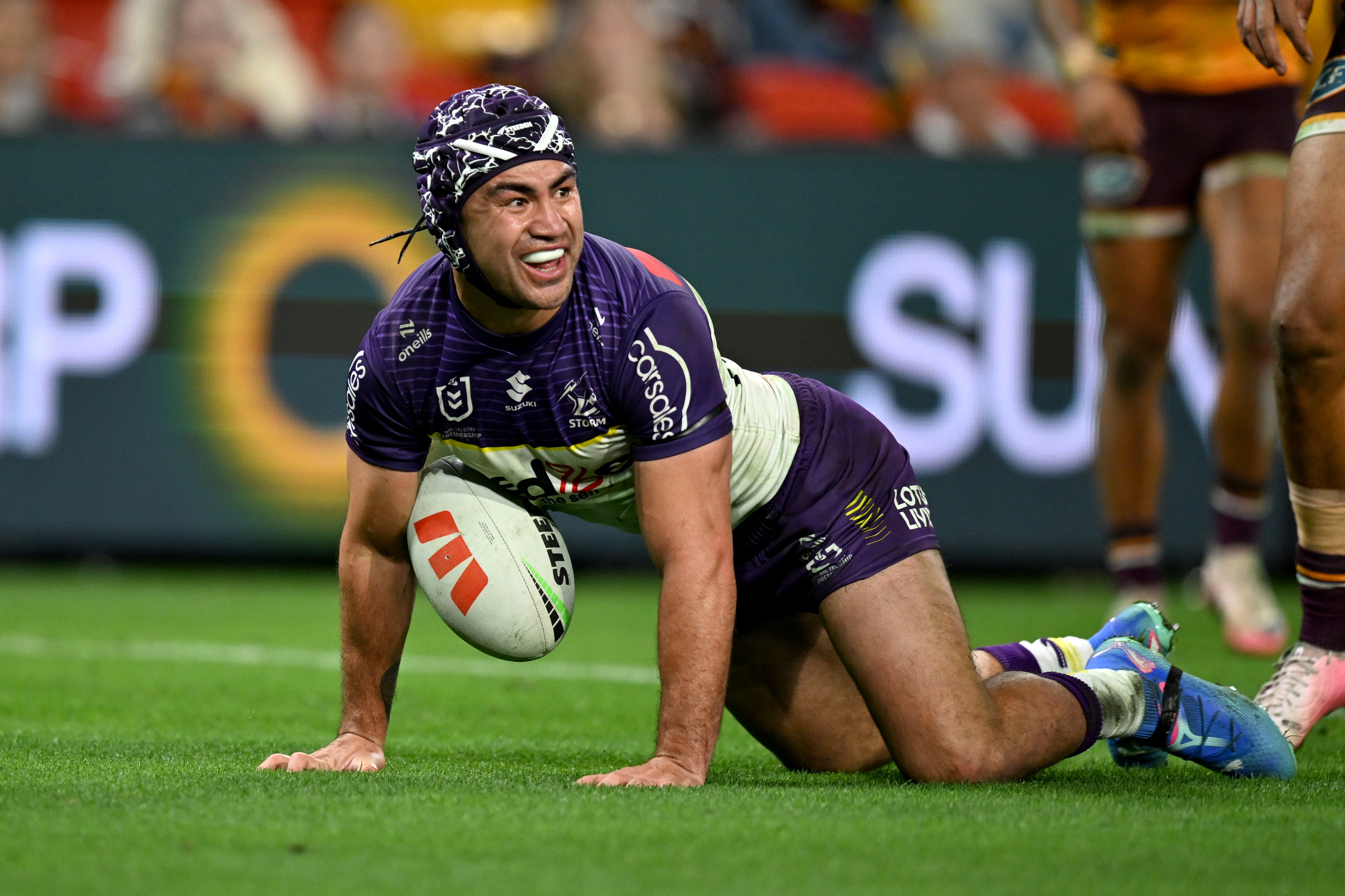 Jahrome Hughes celebrating after scoring a try for the Melbourne Storm against the Brisbane Broncos in round 27.