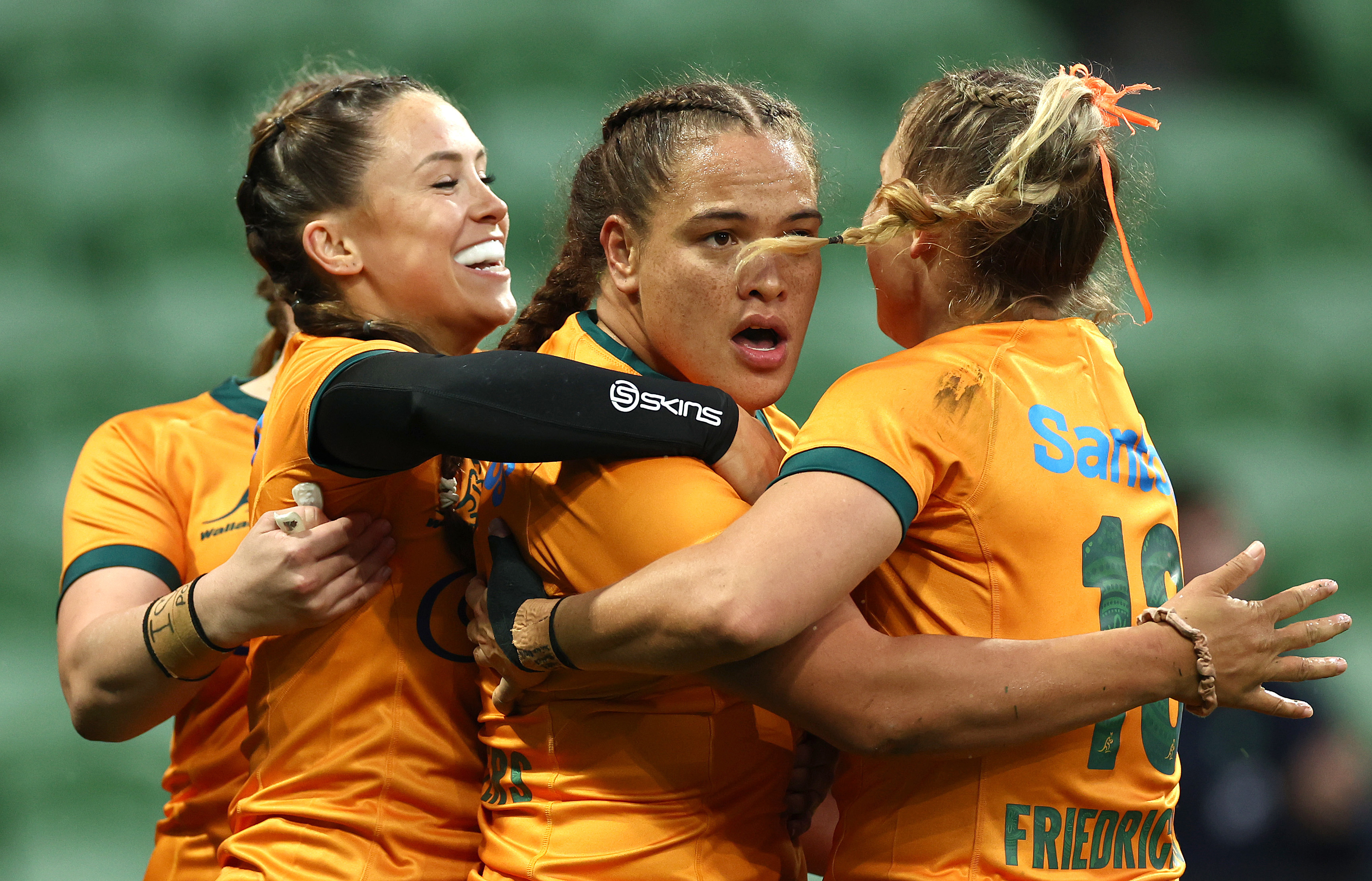 Ashley Marsters of Australia is congratulated by teammates after scoring a try.