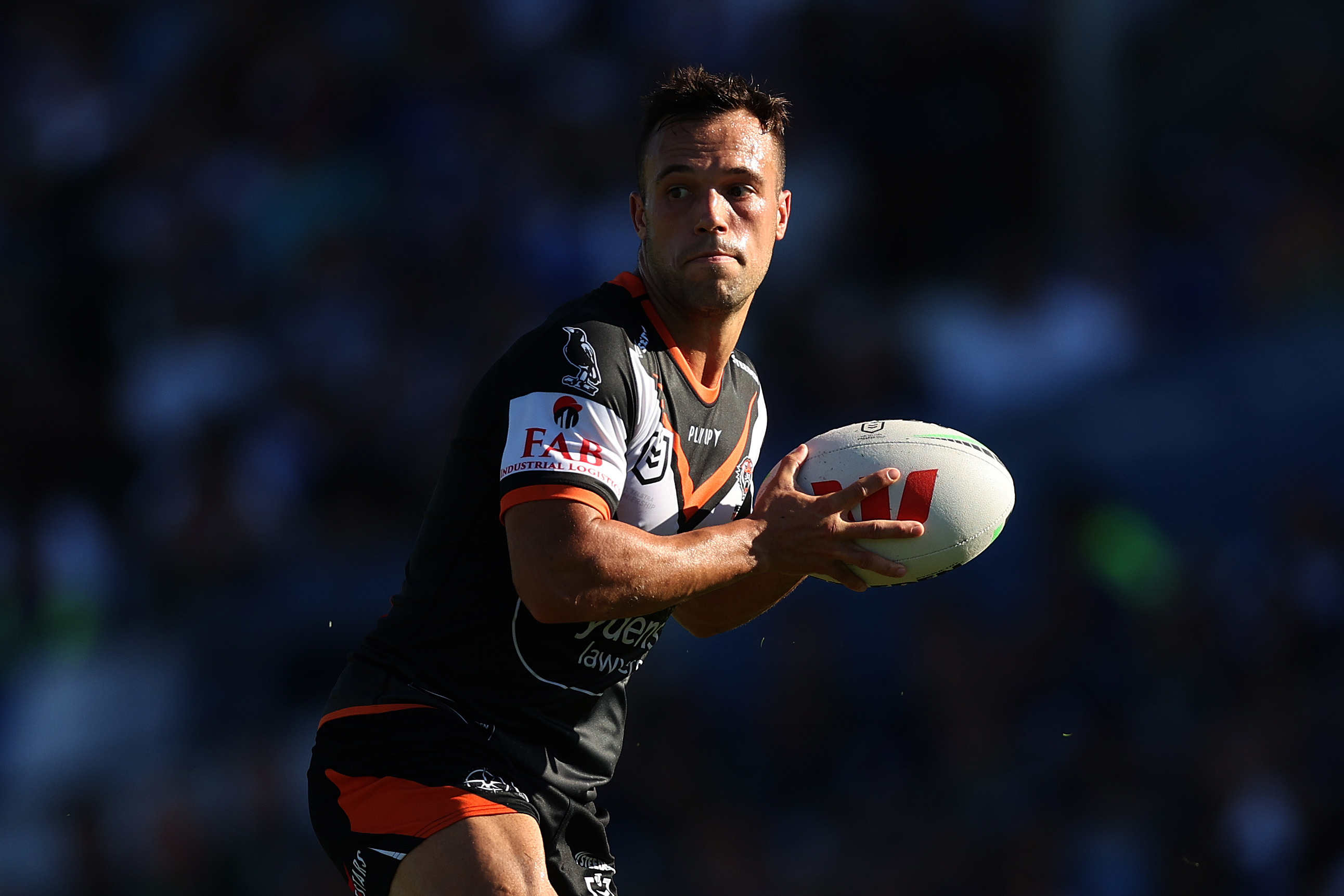 Luke Brooks of the Wests Tigers in action during the round three NRL match between Canterbury Bulldogs and Wests Tigers at Belmore Sports Ground on March 19, 2023 in Sydney, Australia. (Photo by Mark Metcalfe/Getty Images)