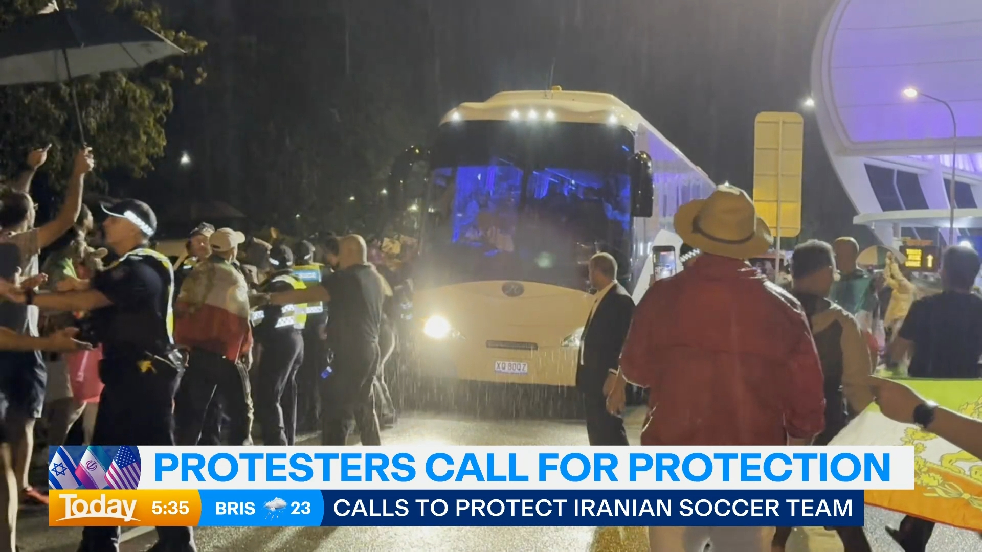 Protestors surround the Iran women's football team's bus as it leaves Gold Coast Stadium.