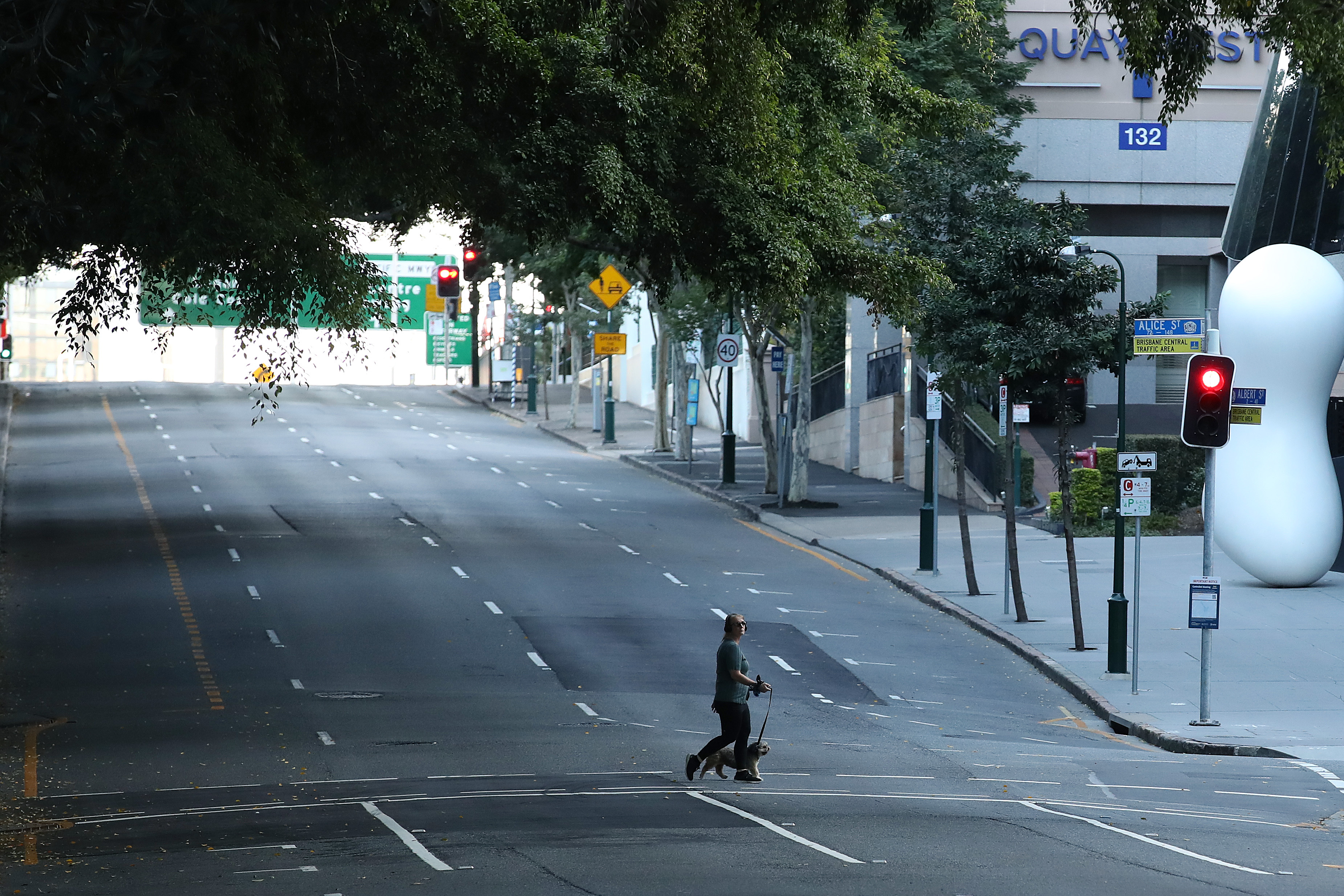 BRISBANE, AUSTRALIA - JULY 31: People are seen walking near the Brisbane CBD after lockdown on July 31, 2021 in Brisbane, Australia. Eleven local government areas in south-east Queensland will enter into a three-day lockdown from 4pm today as six new locally transmitted cases of the Covid-19 delta variant were reported. (Photo by Jono Searle/Getty Images)