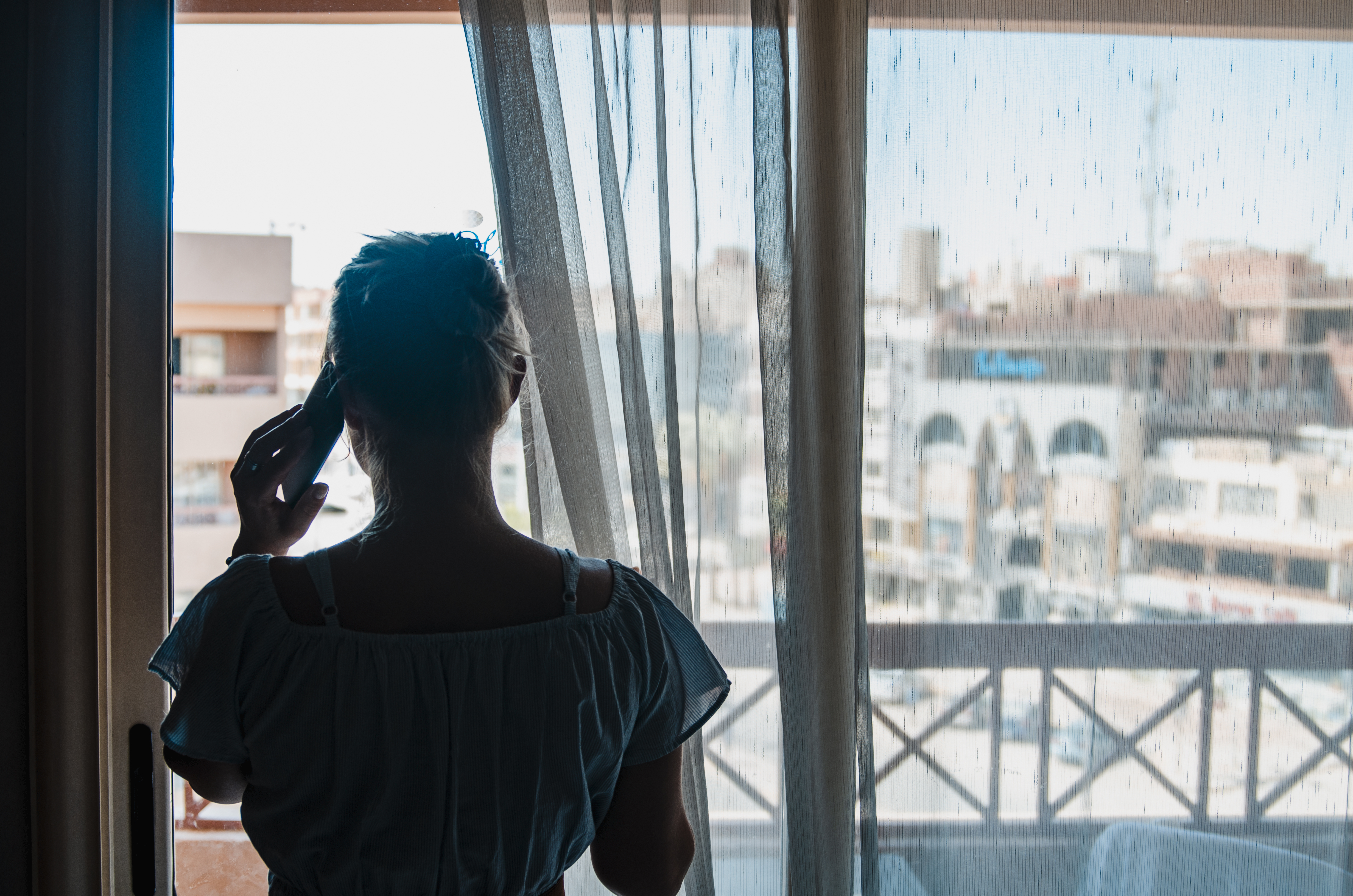 Woman at window during self isolation
