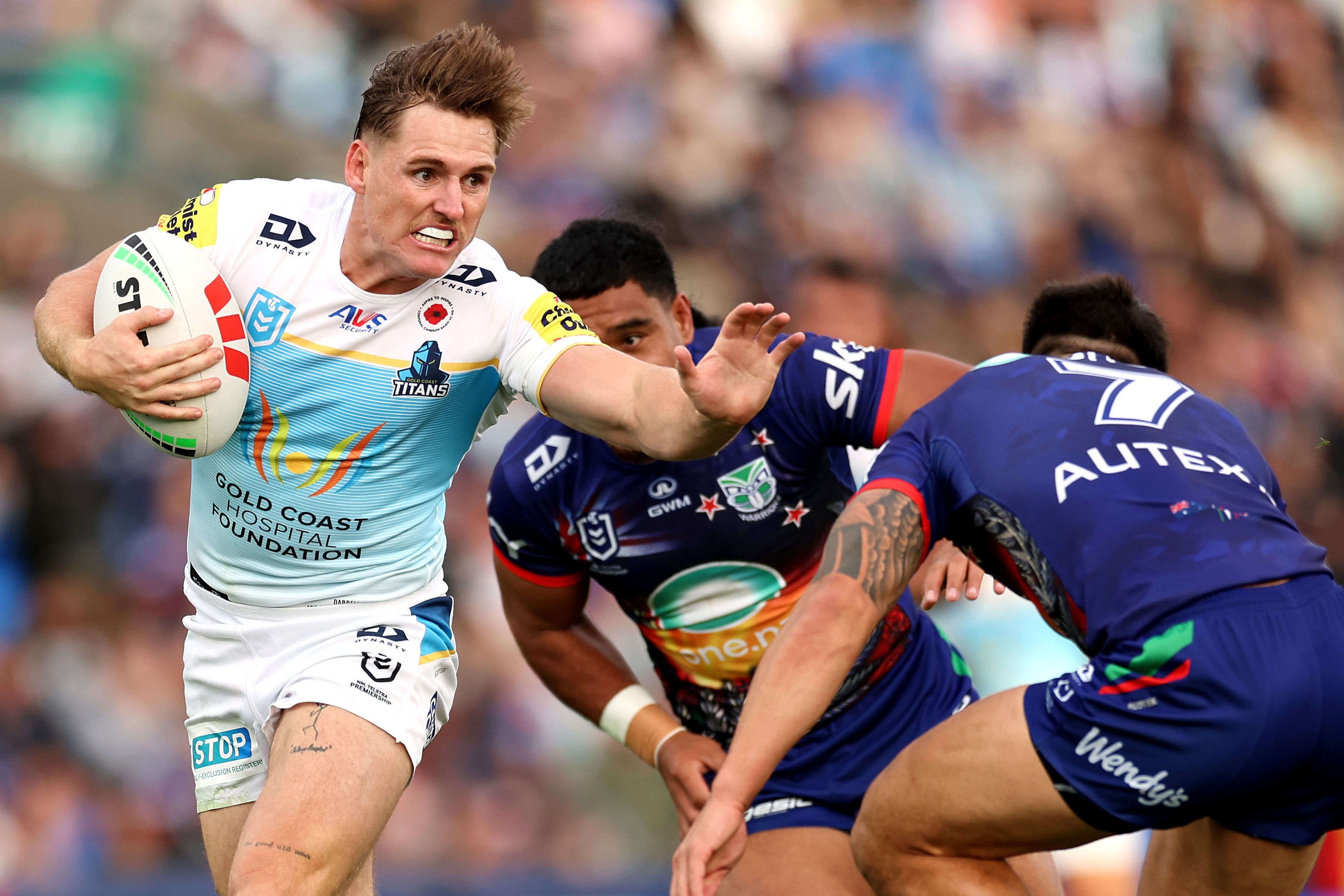 AJ Brimson is tackled during the round eight NRL match between the Warriors and the Gold Coast Titans.