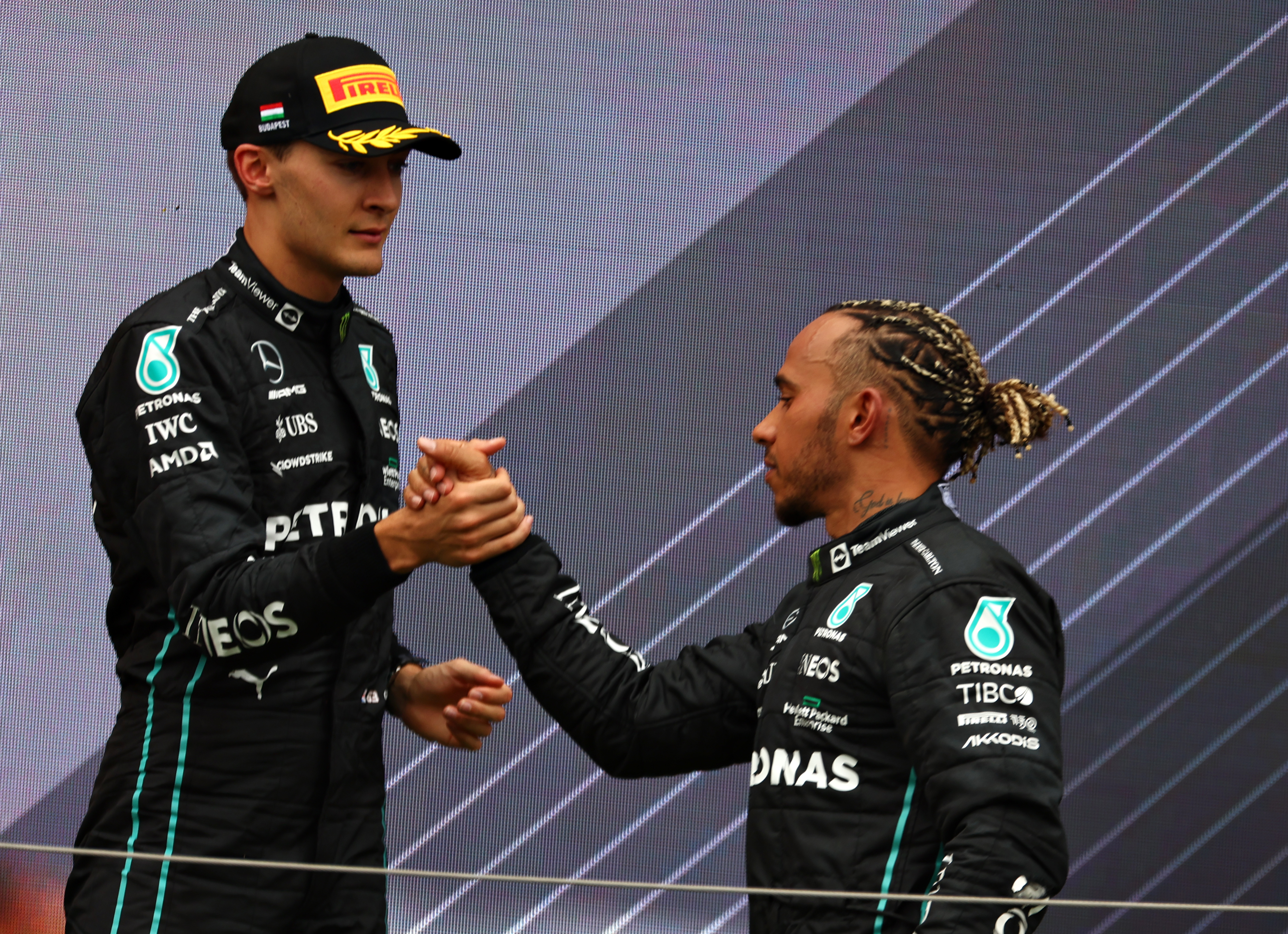 Lewis Hamilton and George Russell on the podium after the F1 Grand Prix of Hungary at Hungaroring on July 31, 2022 in Budapest, Hungary. (Photo by Bryn Lennon - Formula 1/Formula 1 via Getty Images)