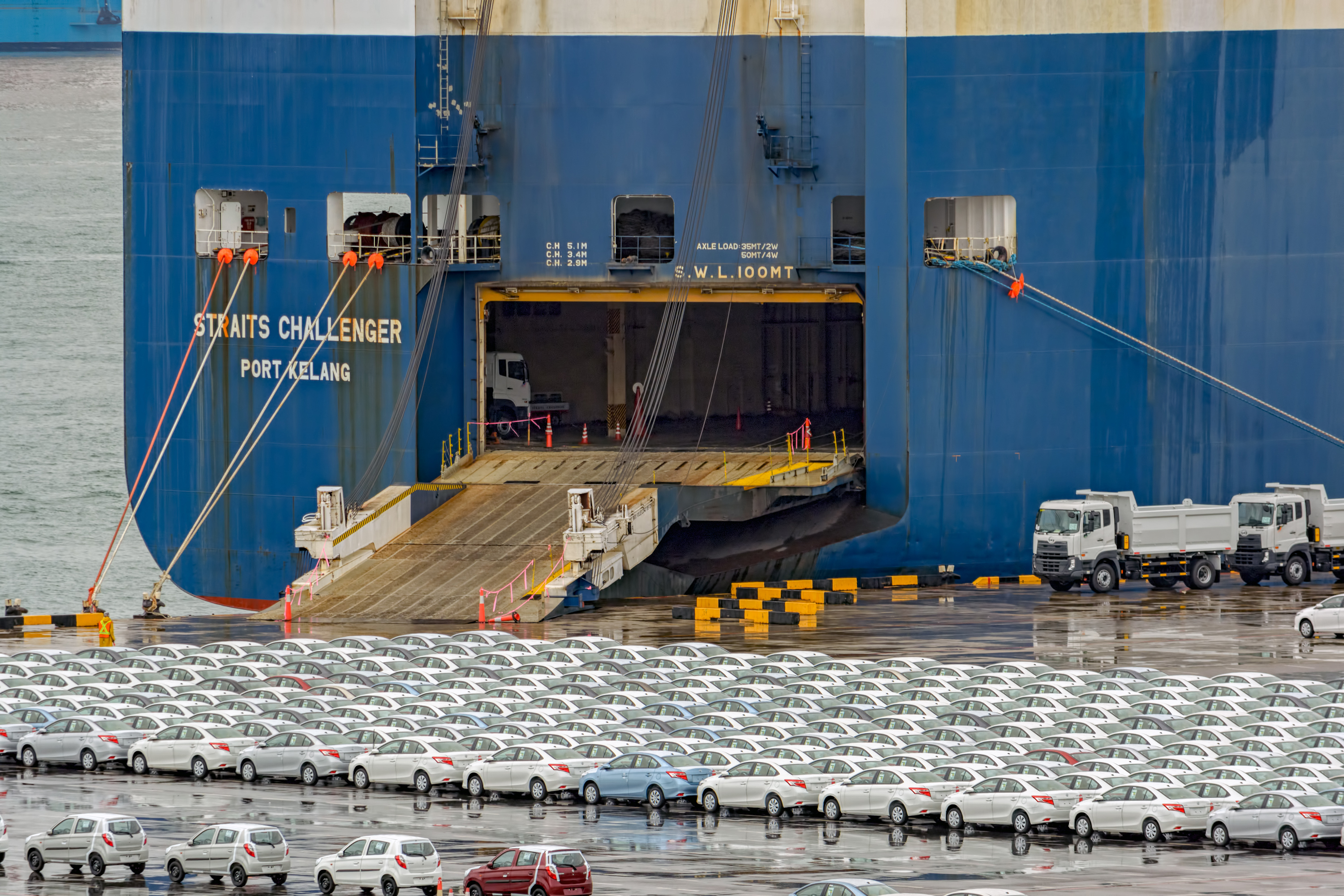 Rows of new cars waiting to be dispatch and shipped around the world from the biggest and busiest cargo port in Malaysia.