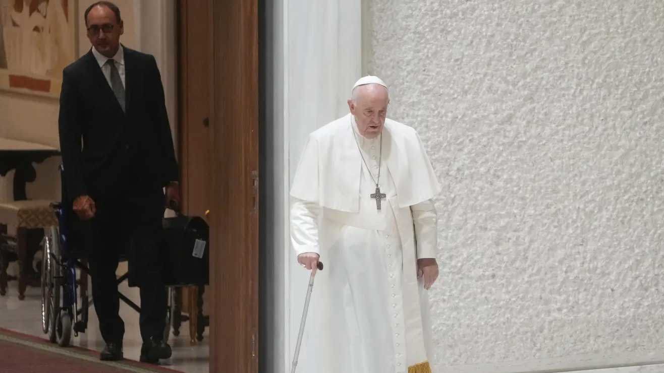 Massimiliano Strappetti watches Pope Francis walking during a general audience in August 2022.