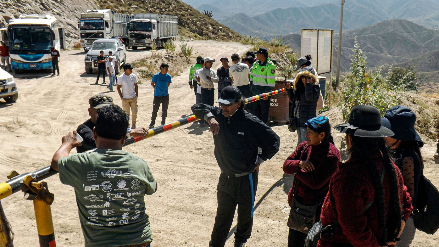 Miners' relatives wait at the entrance of the mine following the fire.