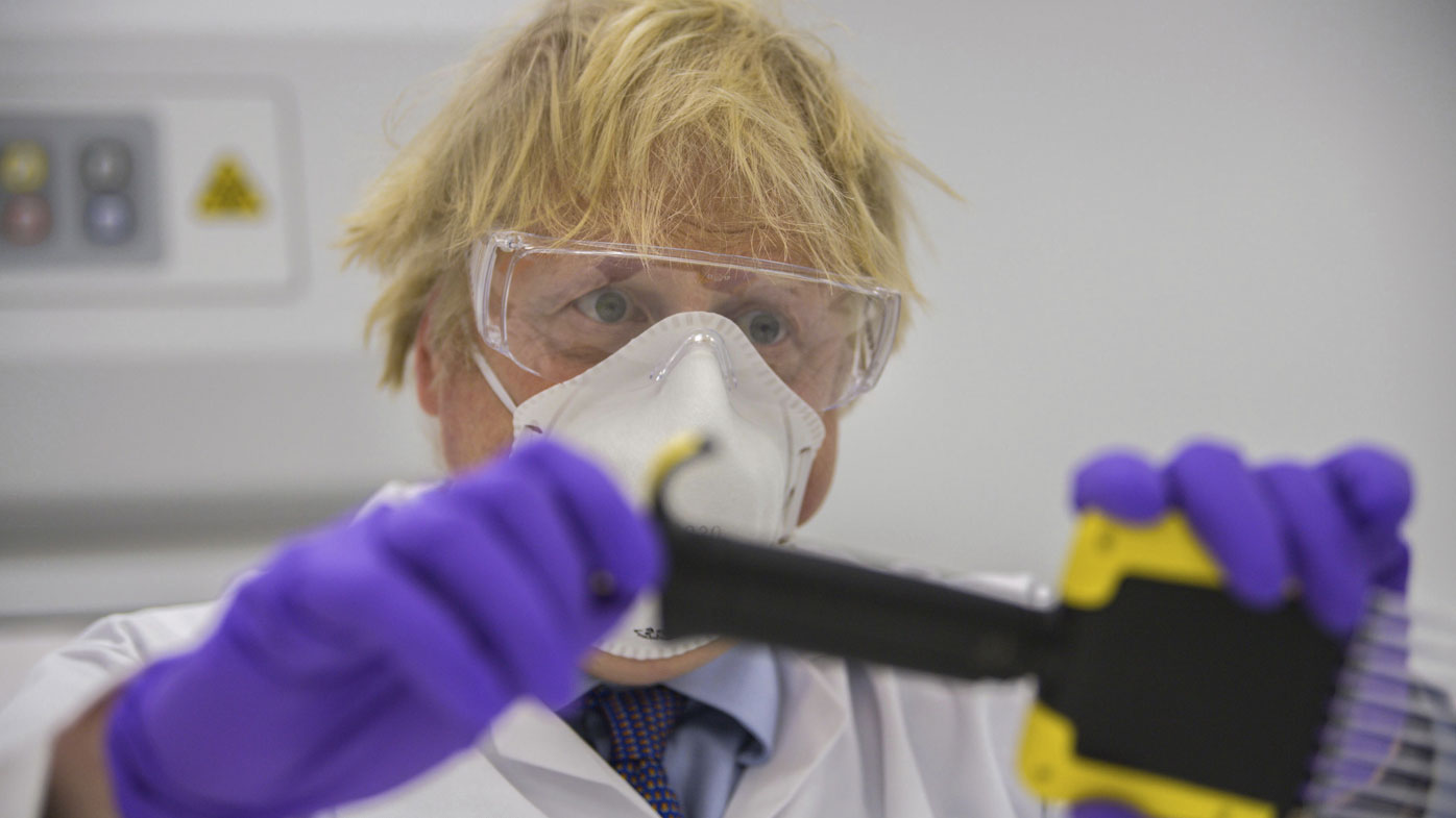 Britain's Prime Minister Boris Johnson visits the French biotechnology laboratory Valneva in Livingston, Scotland, Thursday Jan. 28, 2021, where they will be producing a COVID-19 vaccine on a large scale, during a visit to Scotland.