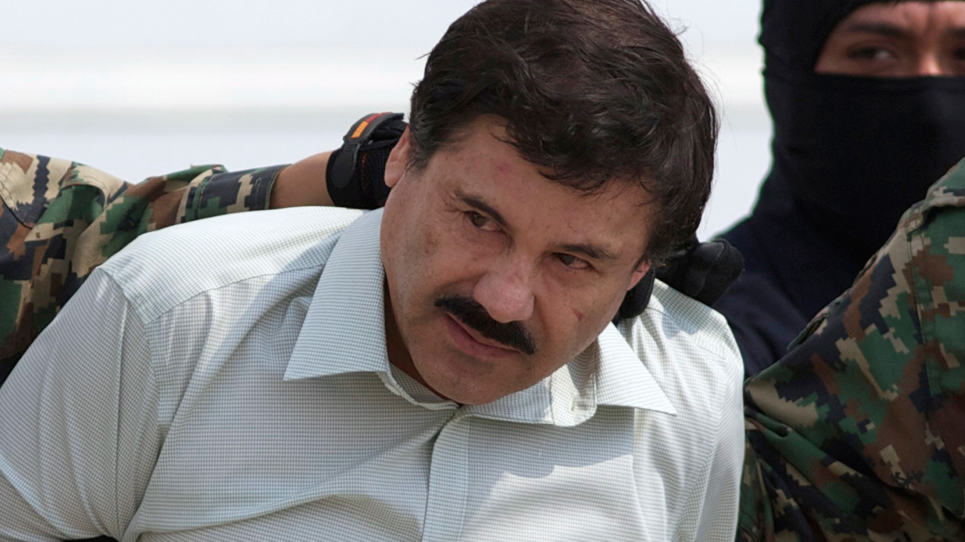 Joaquin "El Chapo" Guzman, the head of Mexico's Sinaloa Cartel, being escorted to a helicopter in Mexico City following his capture in the beach resort town of Mazatlan